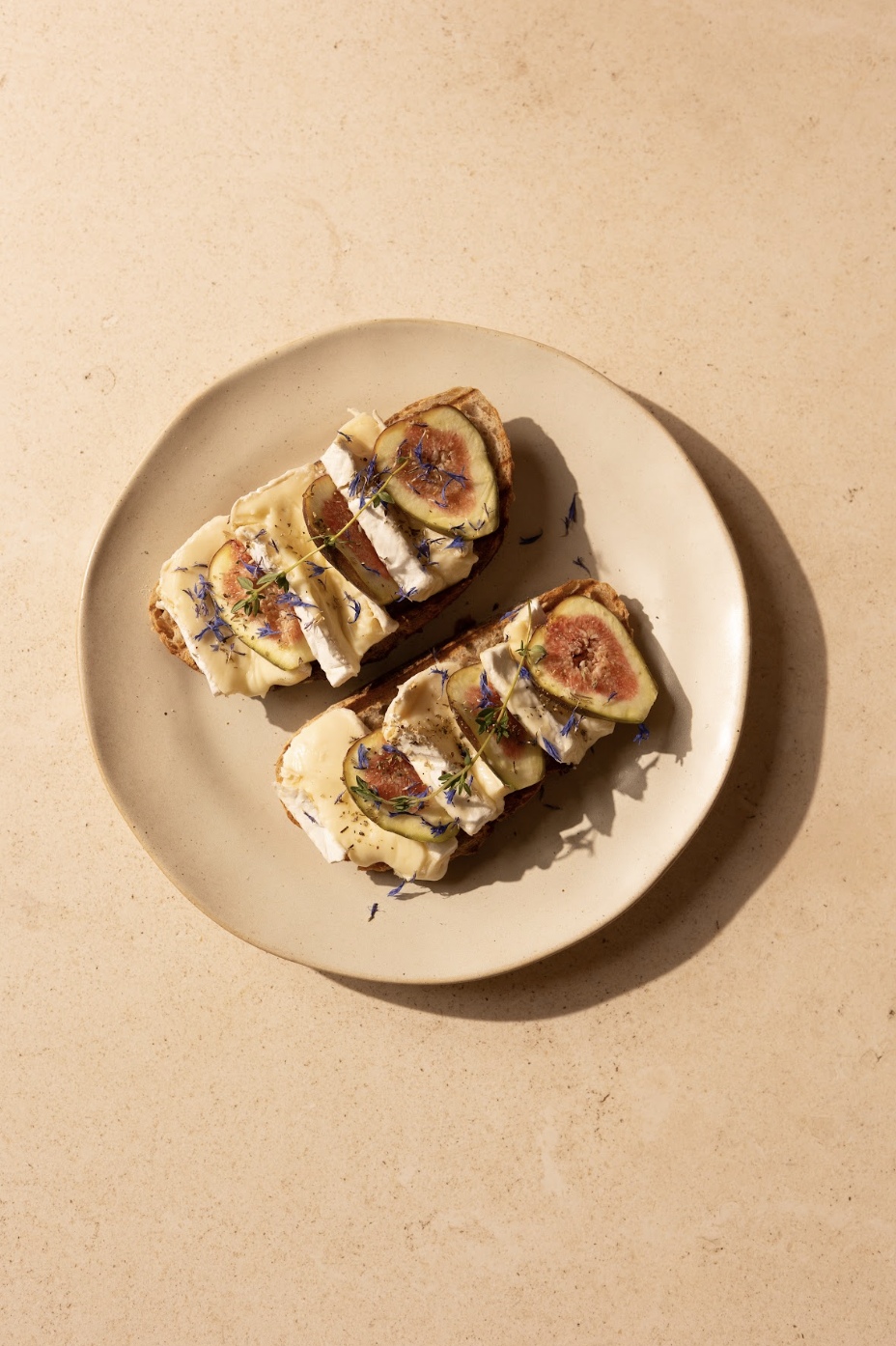 Fig, brie and honey on toasted sourdough with edible flowers — Social Goods Modern Bakery, Wellington Street Central.