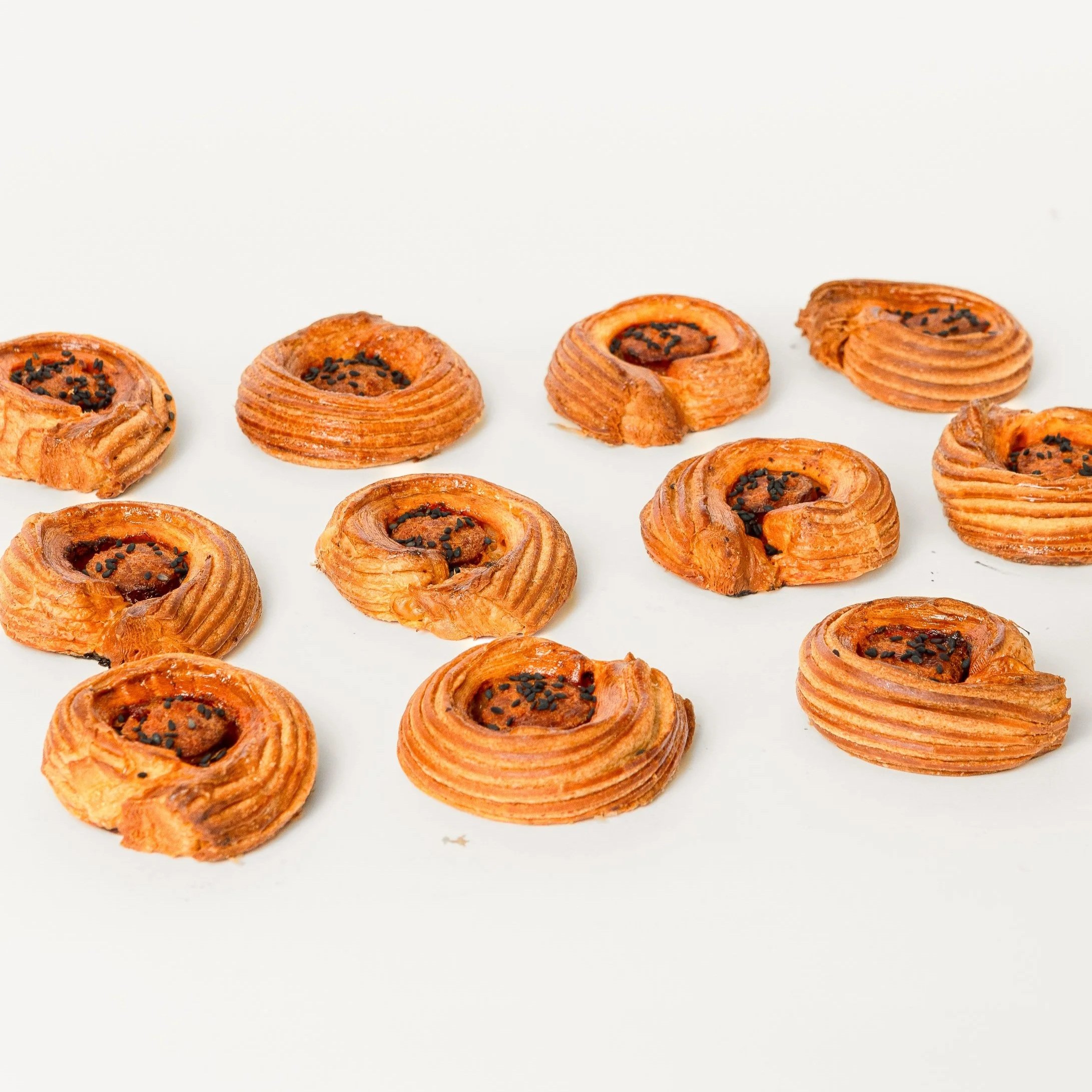 Mini Cinnamon Rolls — swirls of laminated pastry with cinnamon and chocolate sprinkles, Social Goods Modern Bakery.