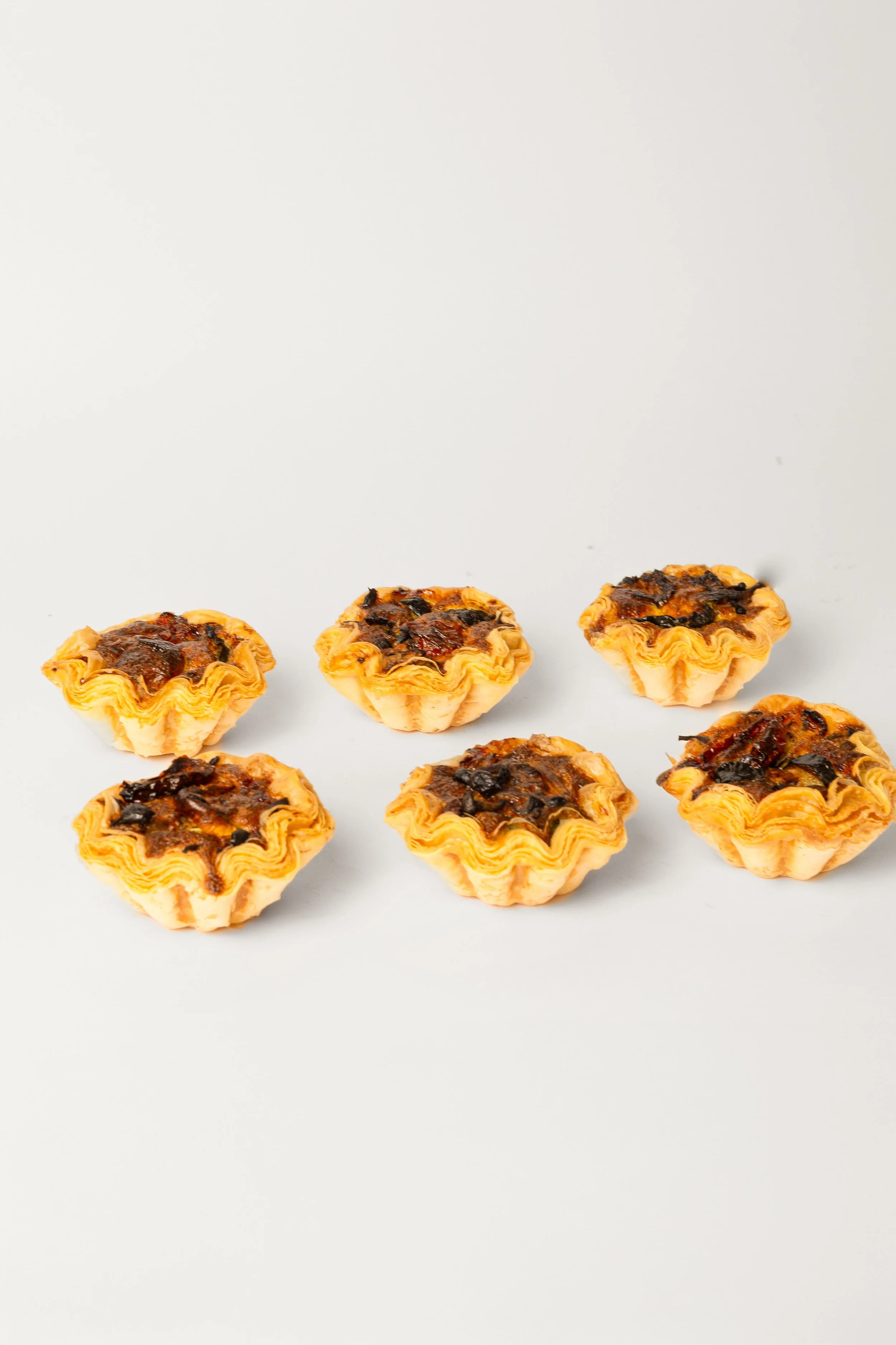 Mini Quiche — pastry crust with savoury filling, catering platter format, Social Goods Modern Bakery.