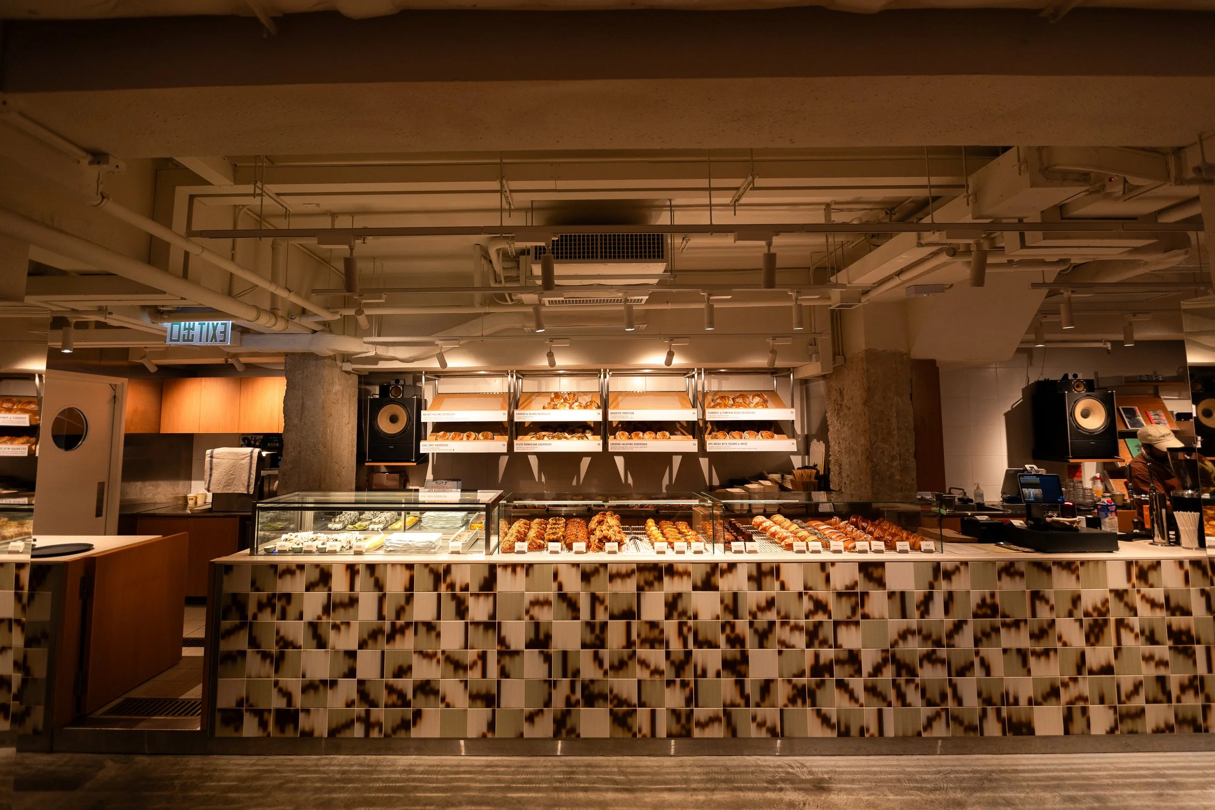 Social Goods Modern Bakery interior — pastry and bread display case at our Central Hong Kong cafe on Wellington Street.