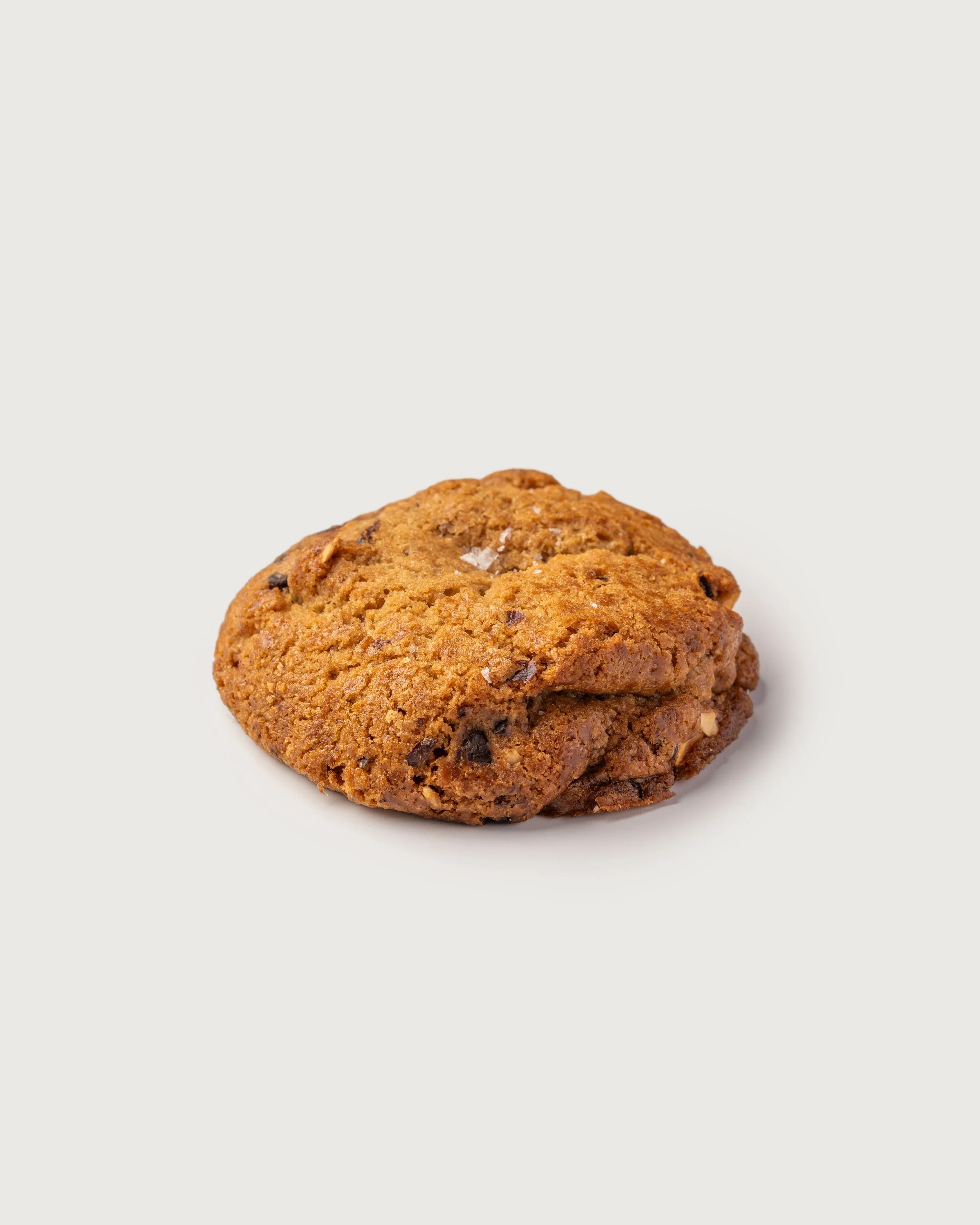 Close-up of a chocolate chip with nuts and sea salt- cookie, Social Goods Modern Bakery