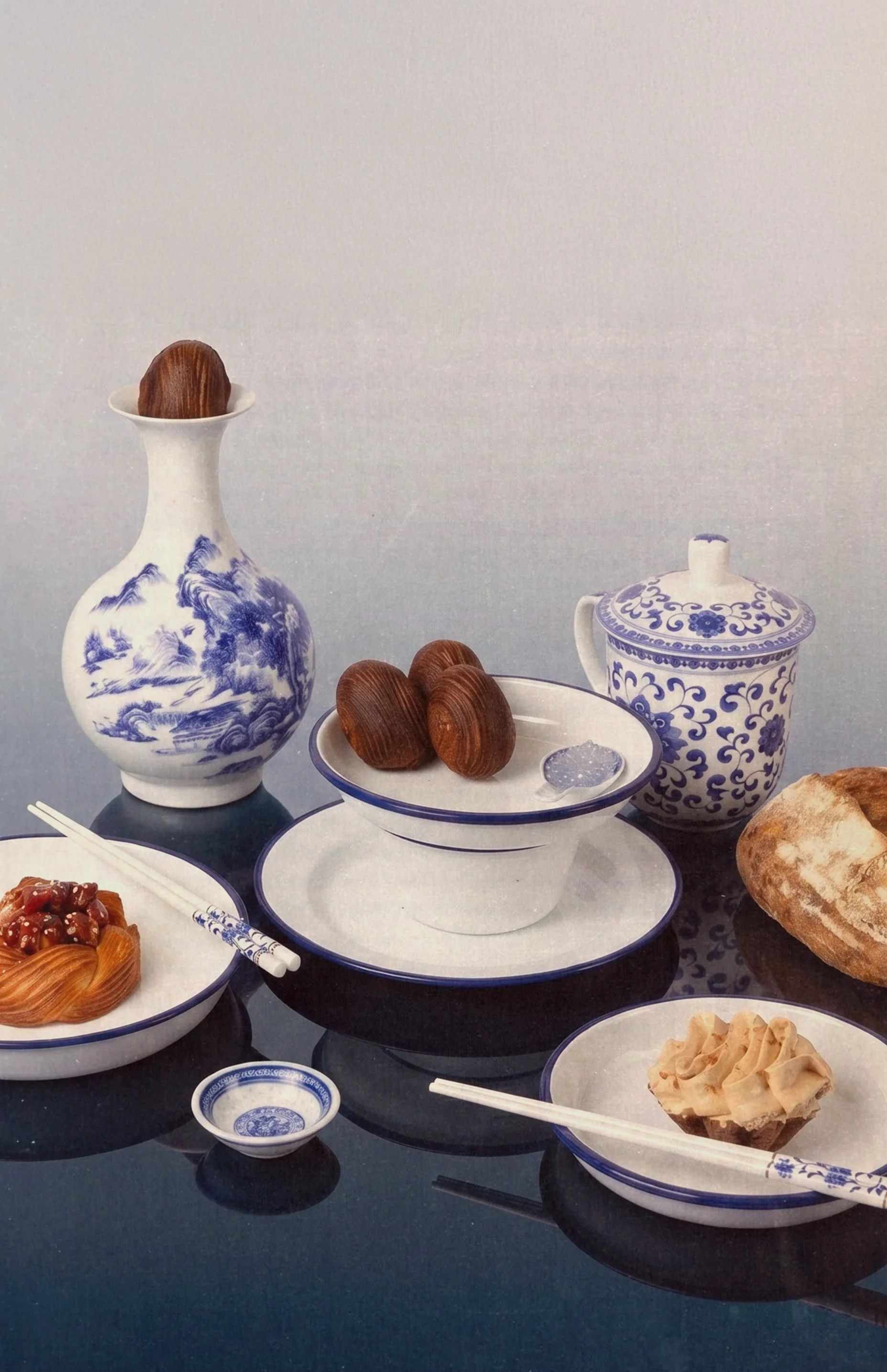 Social Goods table setting — Asian-style blue and white porcelain with pastries and tea, Modern Bakery editorial.