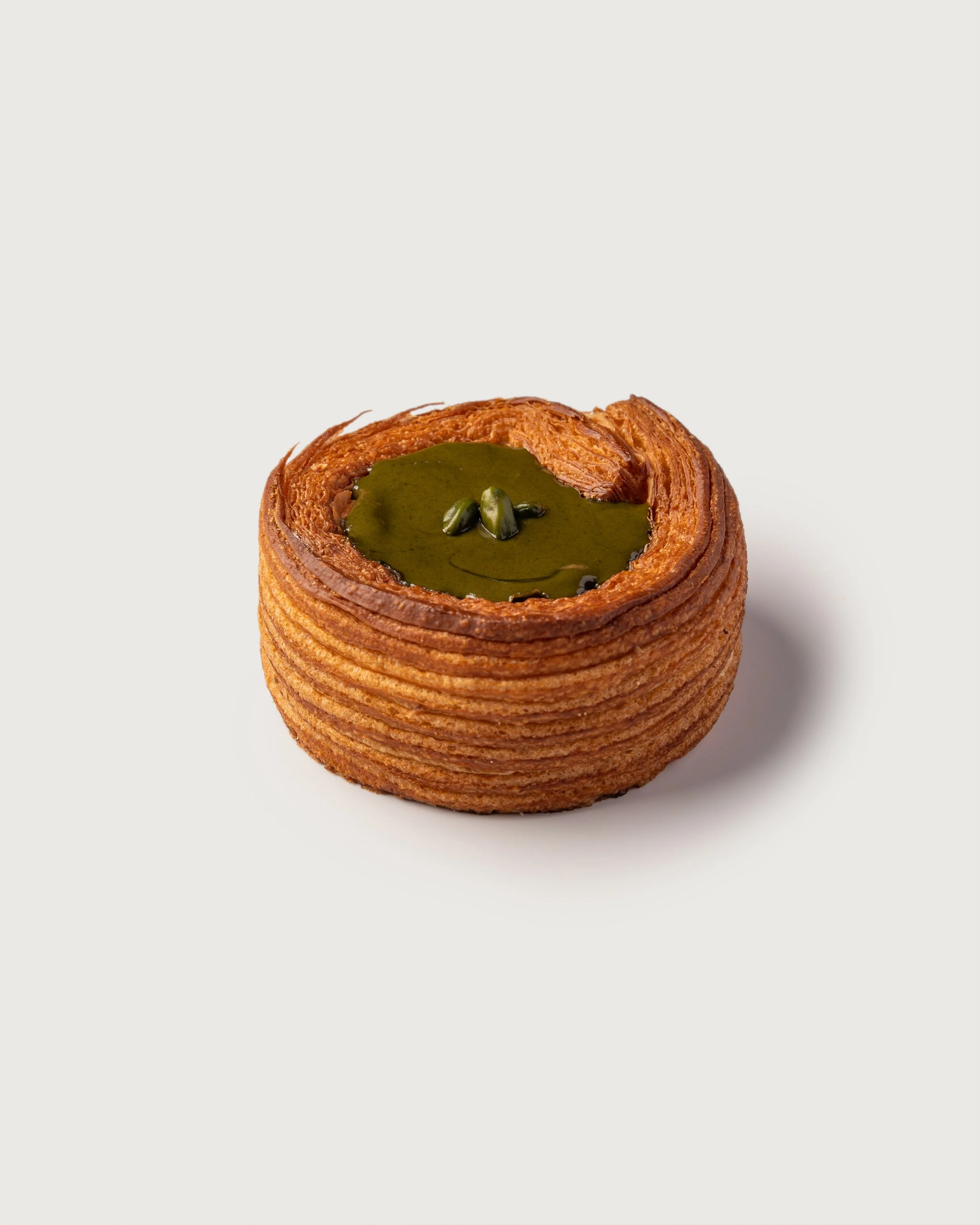 Pistachio Tart with pistachio cream and chopped pistachios — Social Goods Modern Bakery.