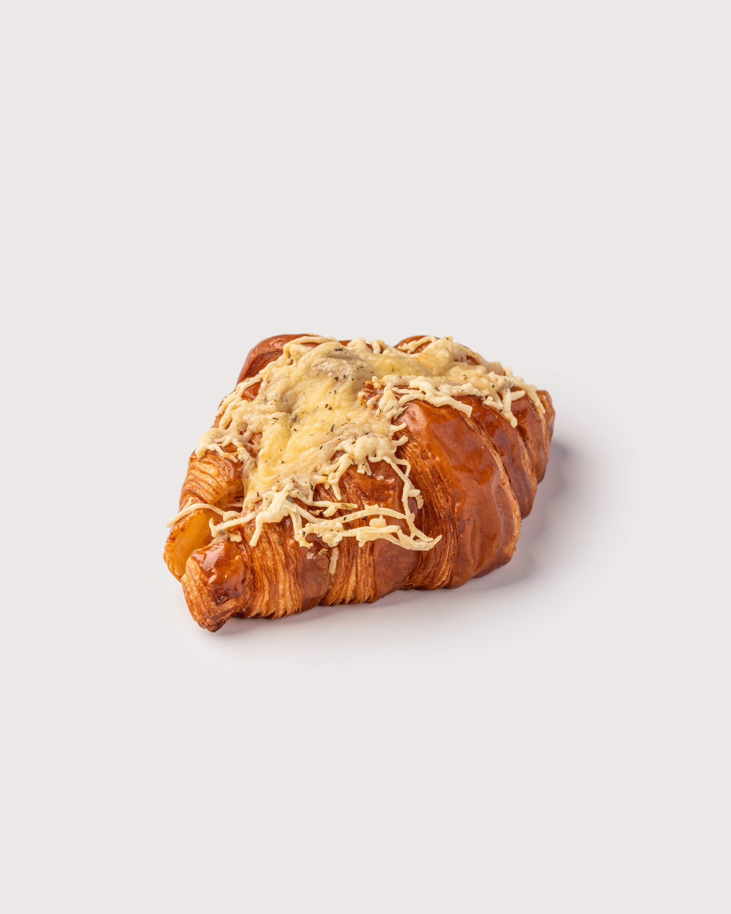 Cheese Croissant Pretzel — laminated pretzel-shaped croissant baked with melted cheese.