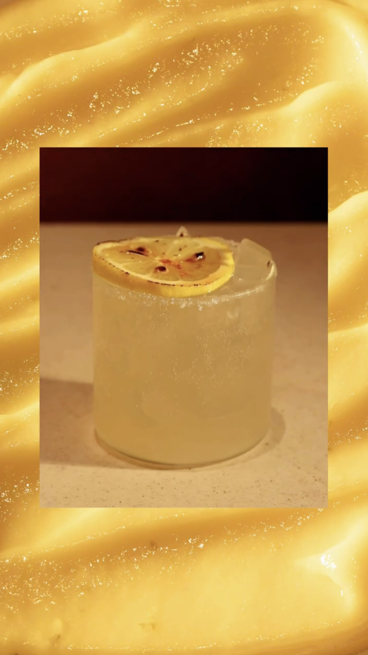 Limoncello lemonade with a fresh lemon slice — Social Goods' August signature drink, Central.