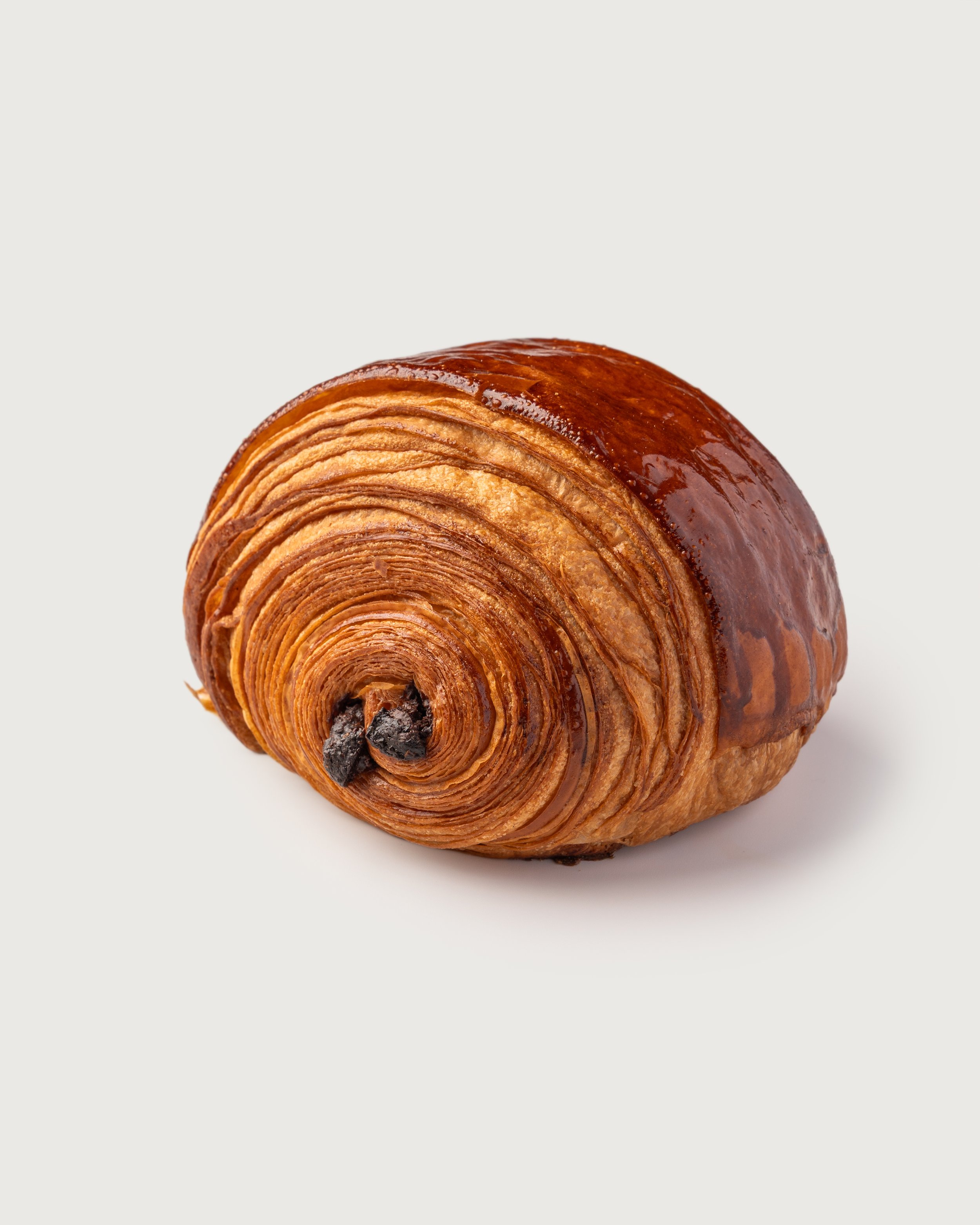Pain au Chocolat — flaky laminated pastry with two batons of dark chocolate, Social Goods Modern Bakery.