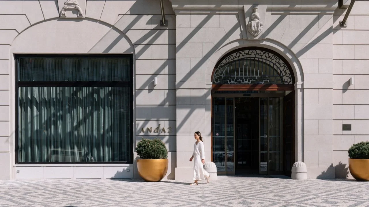 PRGAZ-P0198-Hotel-Exterior-Entrance-Woman-Walking.16x9.adapt.1280.720.jpg