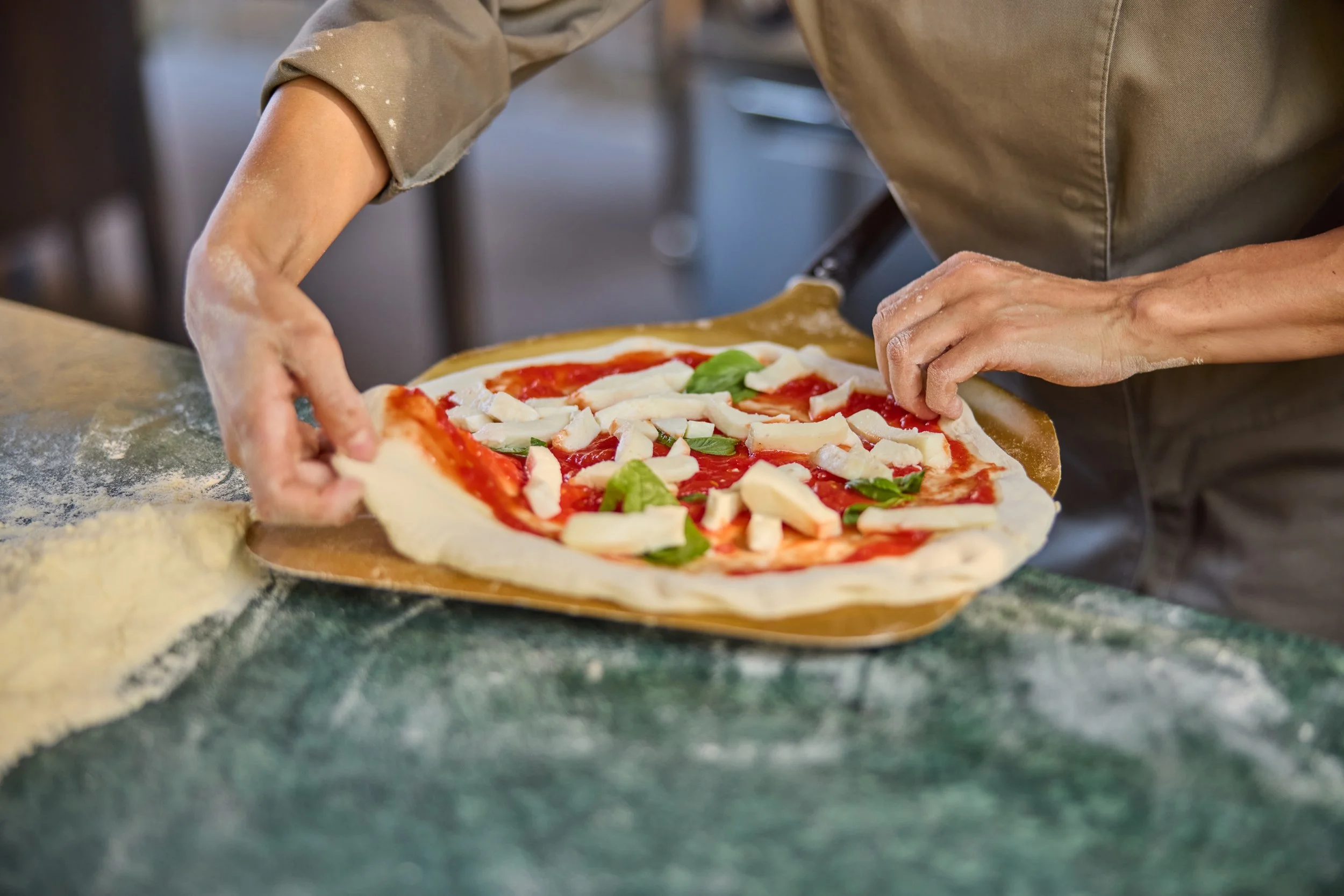 CAQ_Experiences_Pizza-Making_CloseUp_2025.jpeg