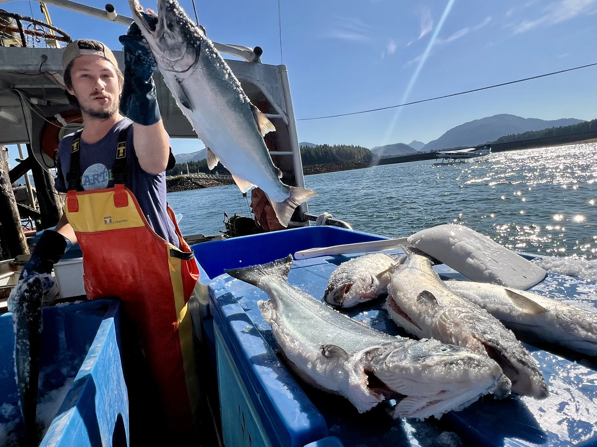 Jay showing his Coho Salmon catch on a sunny South East Alaska day.
