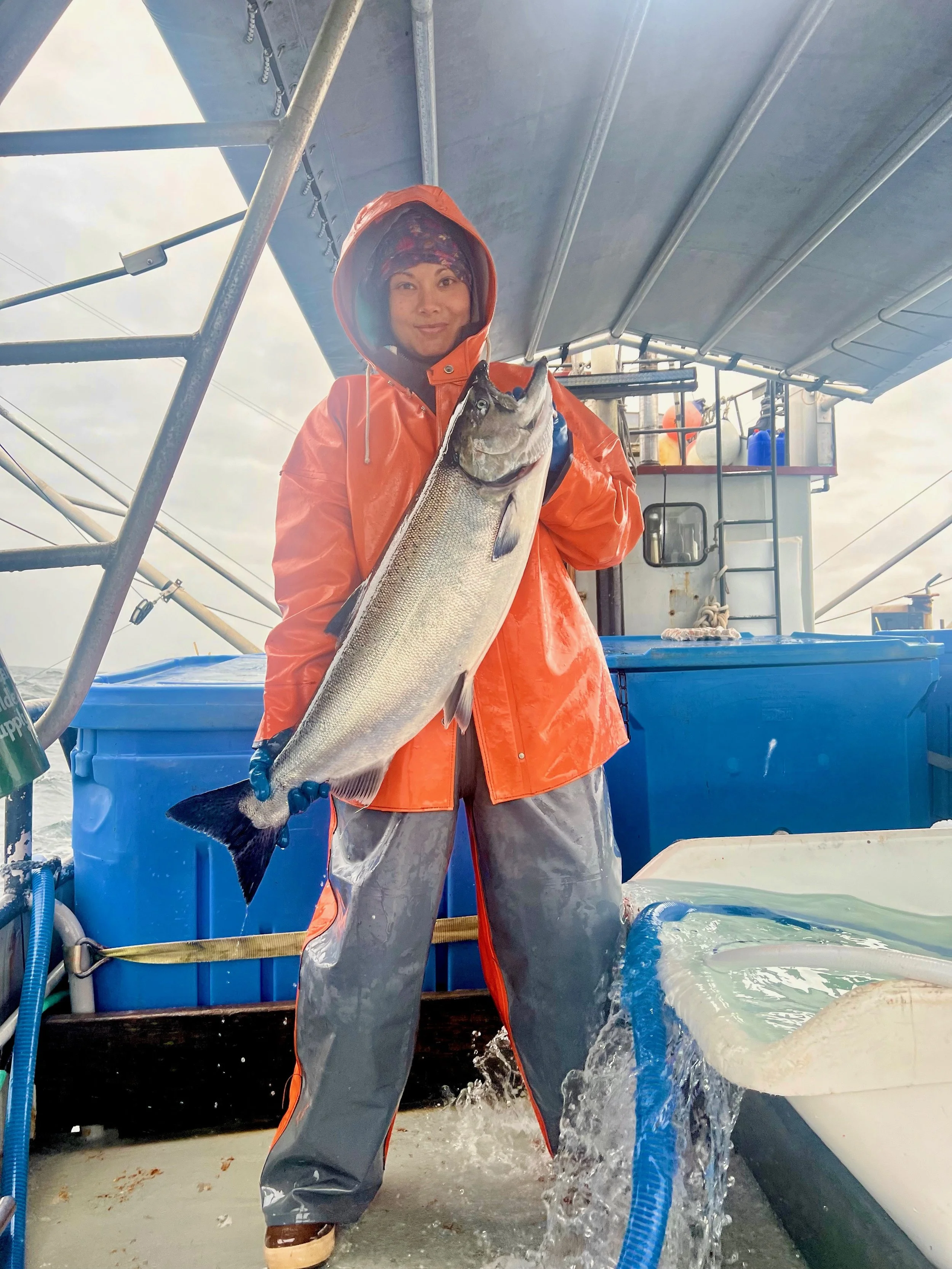 Thais overjoyed with the size of this Wild Alaska Salmon caught on the Mustang