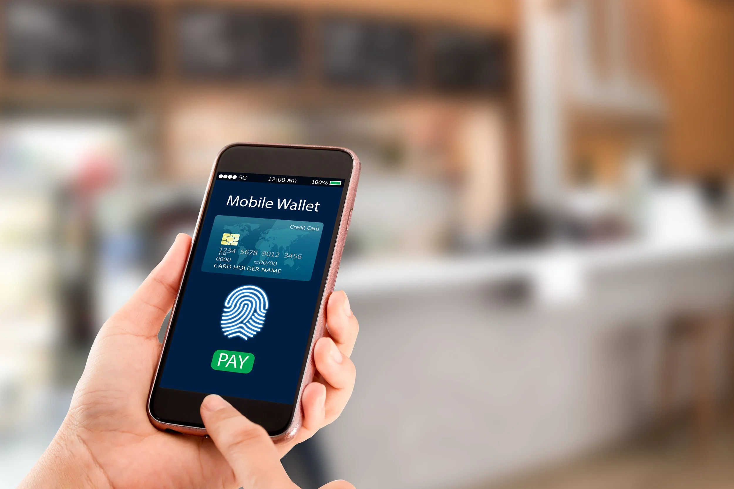 Smartphone displaying the PayPal app logo on a wooden surface.