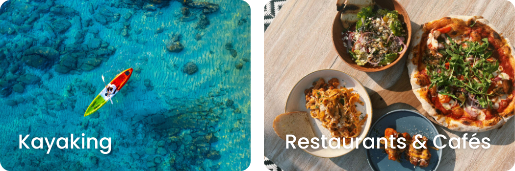 An overhead view of a table with a pizza topped with greens, a small bowl of salad, a bowl of pasta, and a plate with a serving of lasagna on a wooden table.
