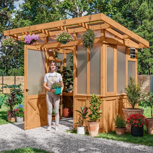 SIZE_9x6_PoppyGreenhouse_Lifestyle_WomanExiting_V1.webp