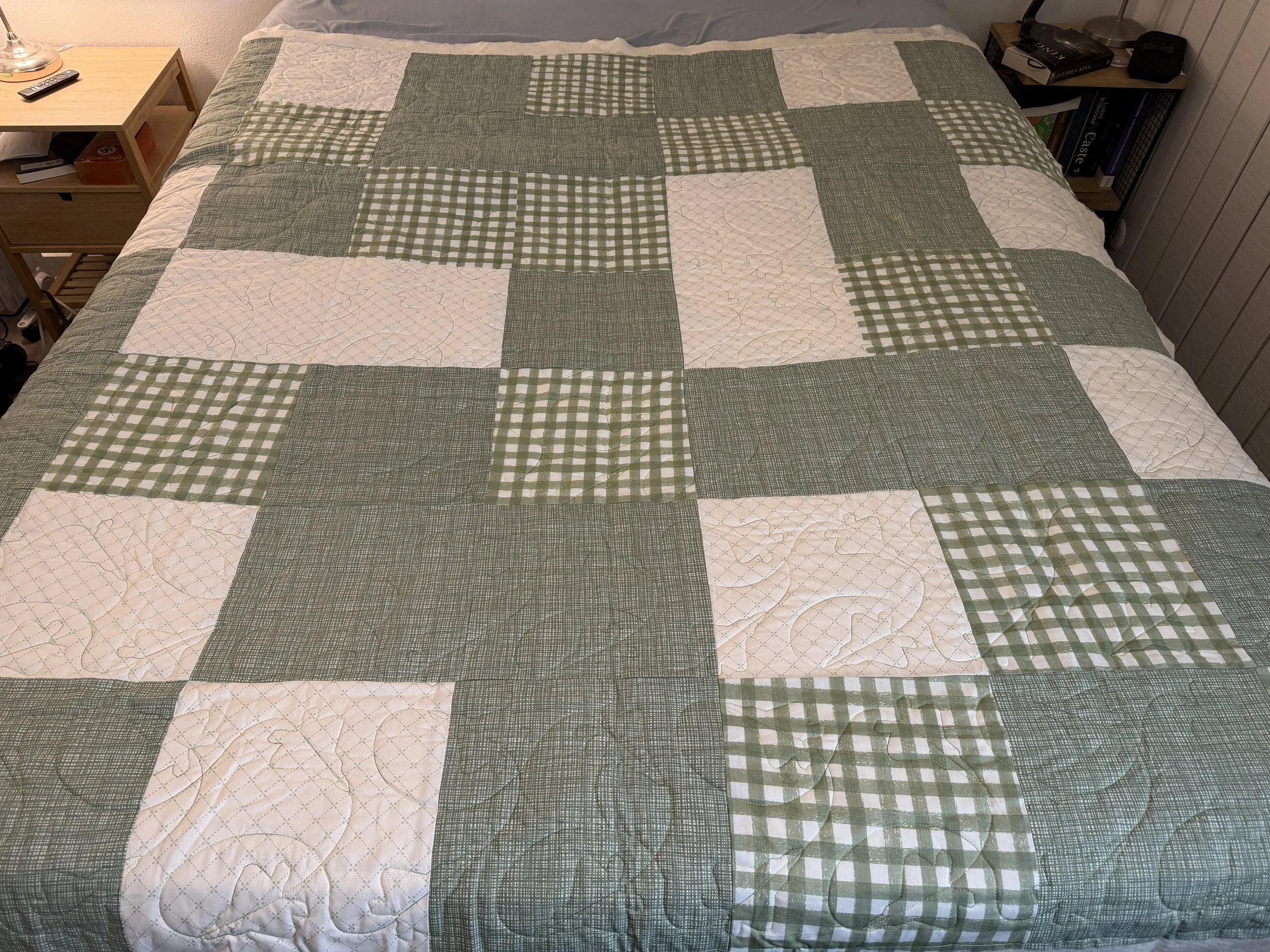 This quilt was provided by a customer giving this to her brother in the Air Force. I created a design of his favorite plane and stitched it out as if it was doing maneuvers in the air. 