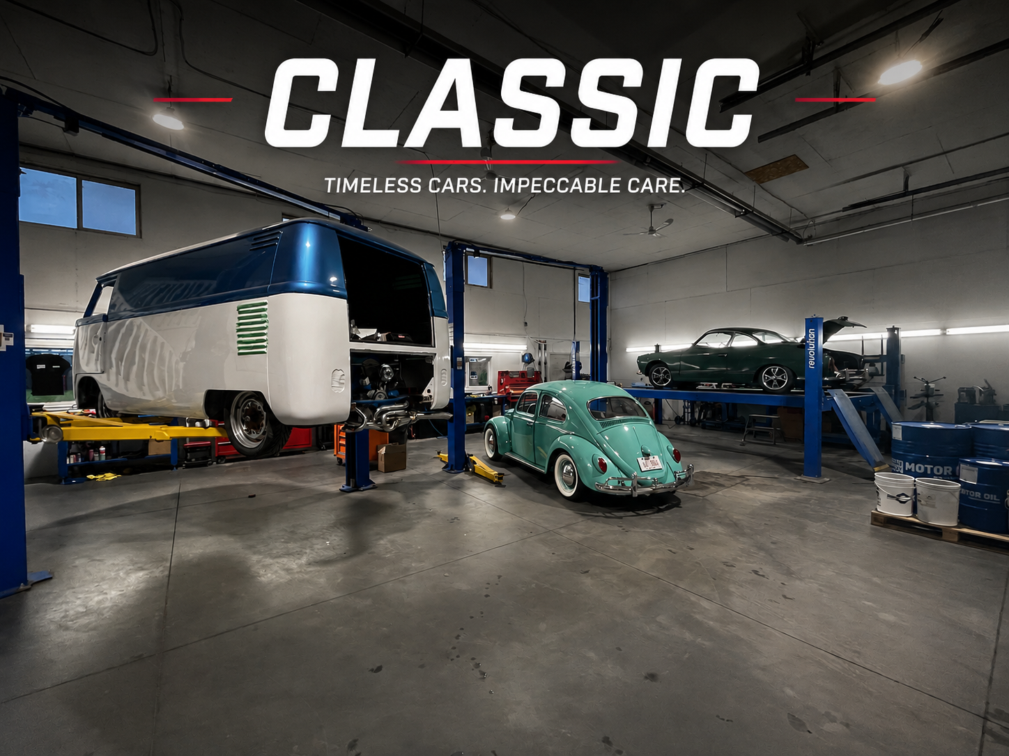 A garage with a vintage green car in the foreground, a partially disassembled classic van on the lift, and a classic dark green coupe on the lift in the background. The space is well-lit with tools and equipment along the walls.