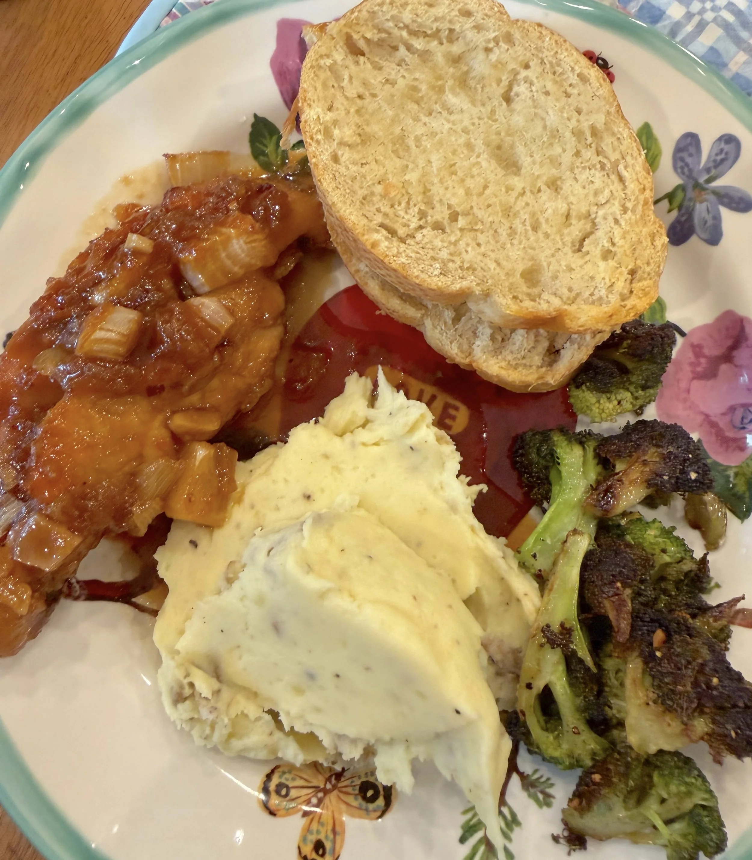 apricot chicken with bread and vegetables