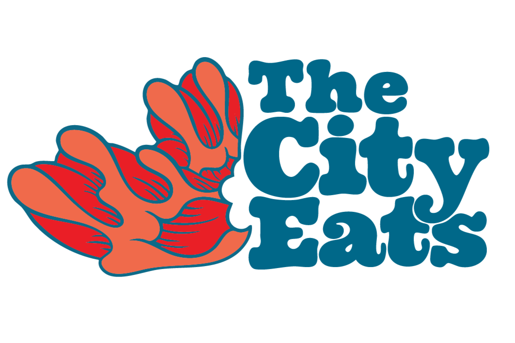 Logo with two stylized orange hands and the text 'The City Eats' in blue.