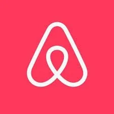 Airbnb logo on a pink background