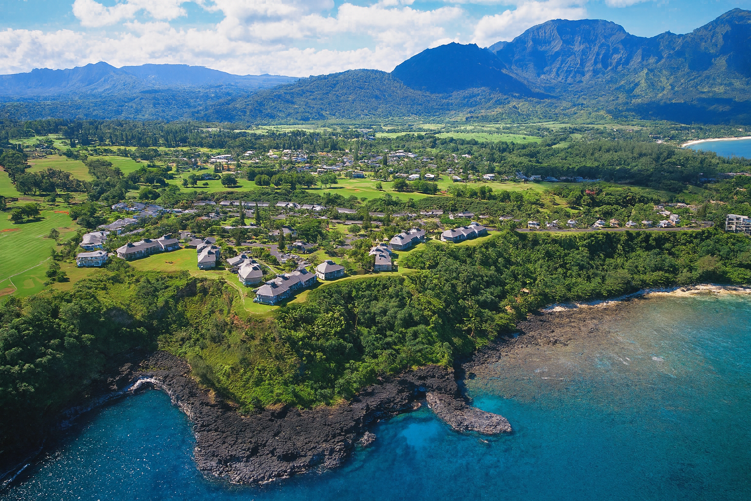 Aerial view of Princeville with Bali Hai mountains in the background.