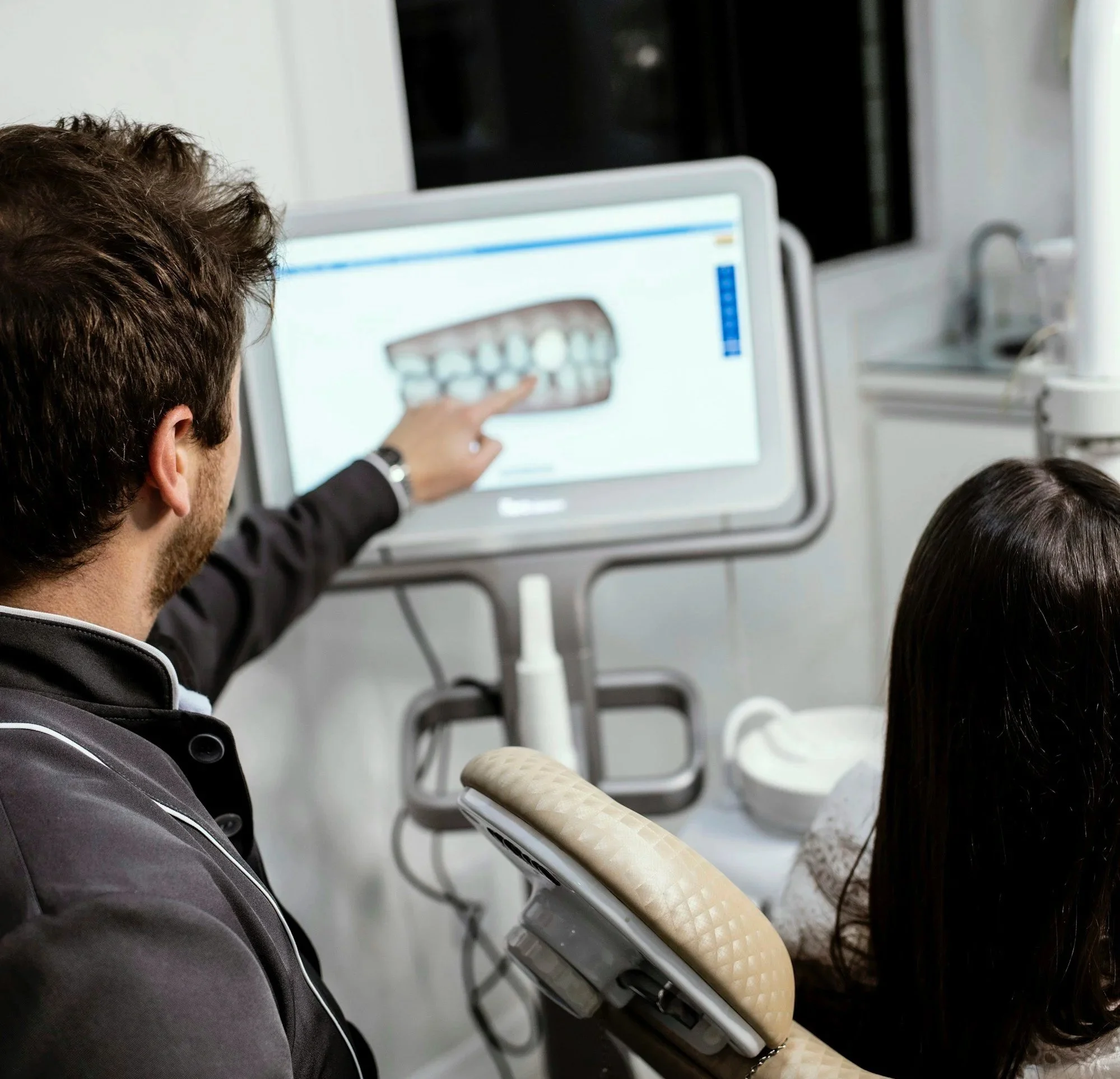 Man checking monitor at dental