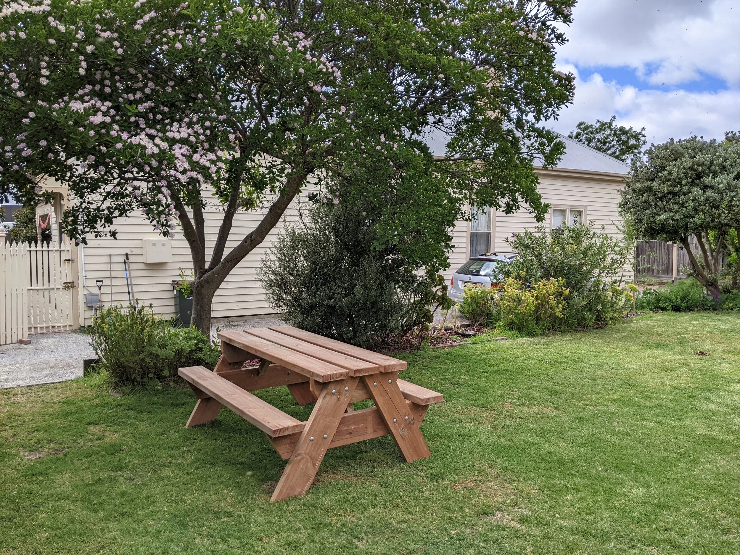 Six seater Picnic Tables displayed in a garden made by Geelong Picnic Tables