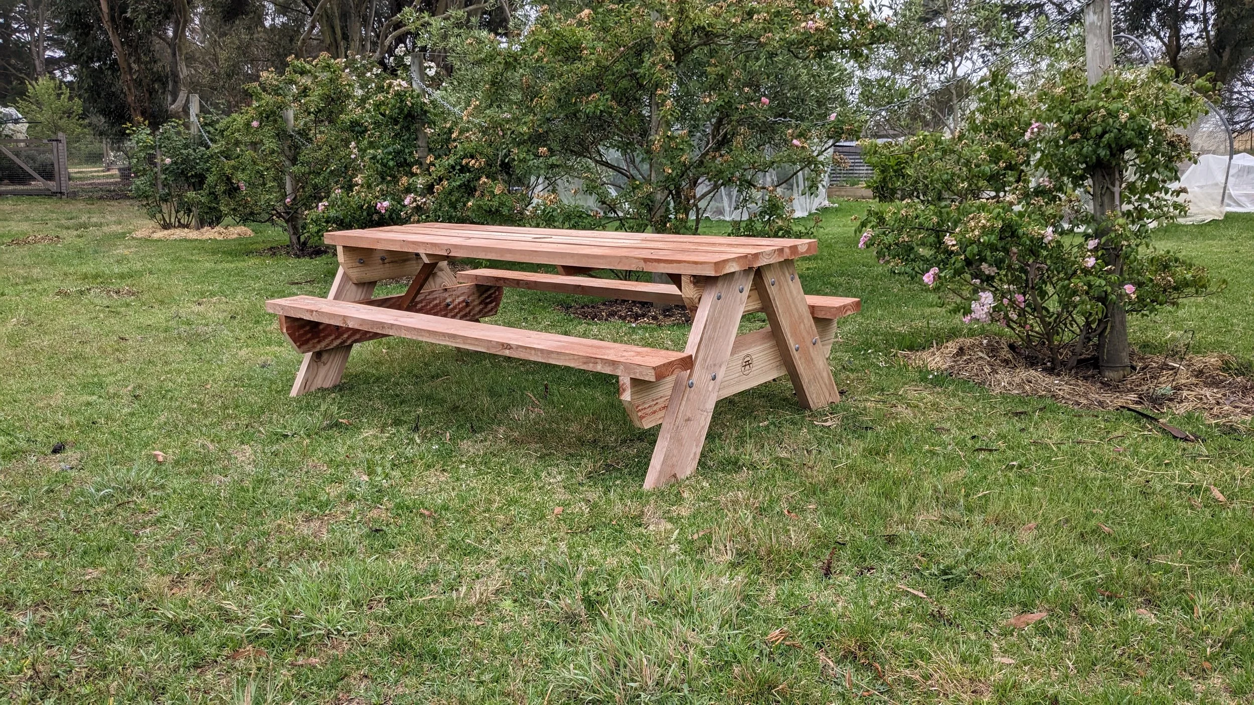 eight seater outdoor tables for gathering in a park