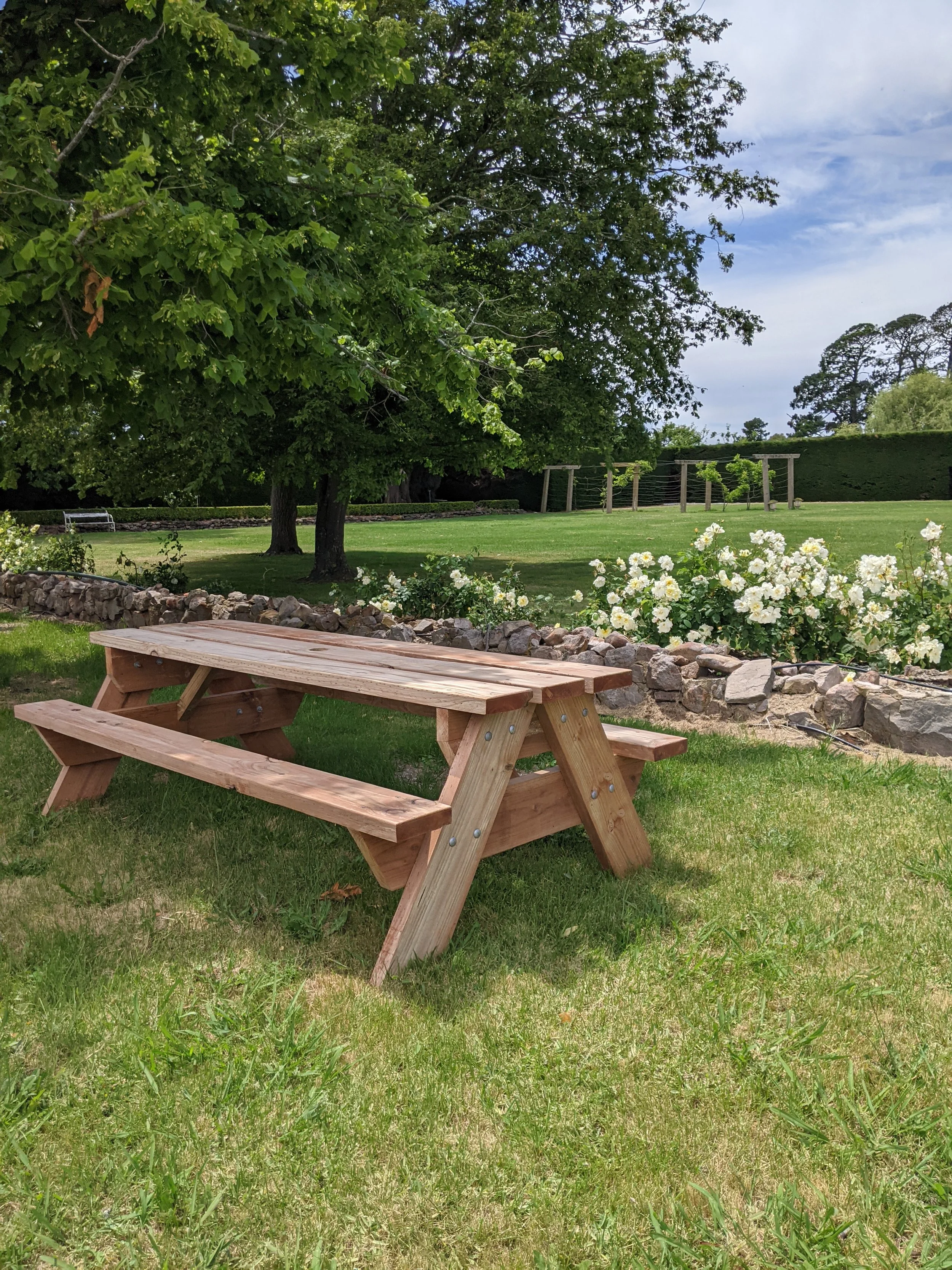 Classic Picnic Table in a garden displayed by Geelong Picnic Tables