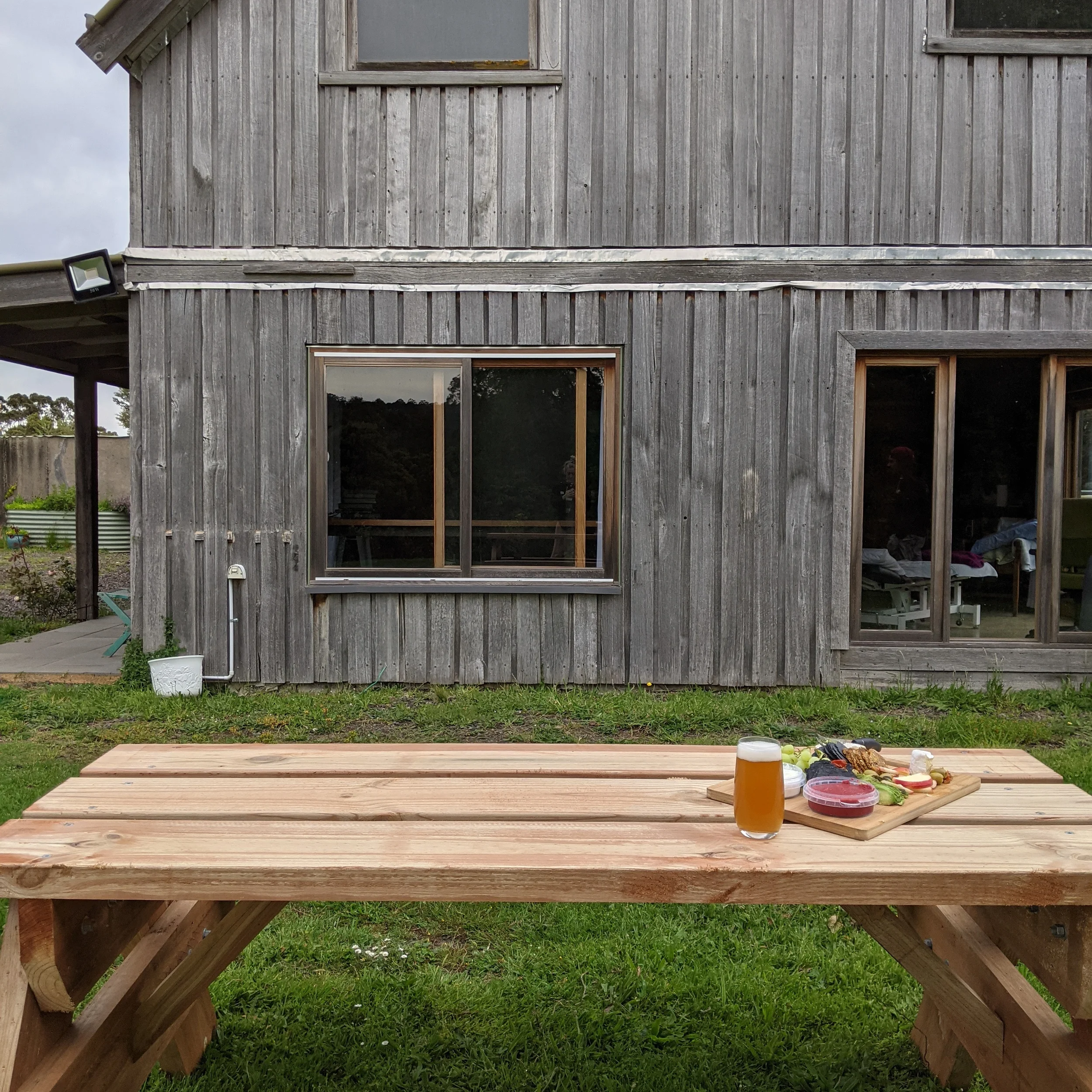 Outdoor picnic tables in backyard