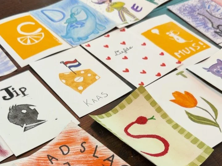 Colourful handmade artworks created during a creative baby shower activity at The Art Café in central Amsterdam.