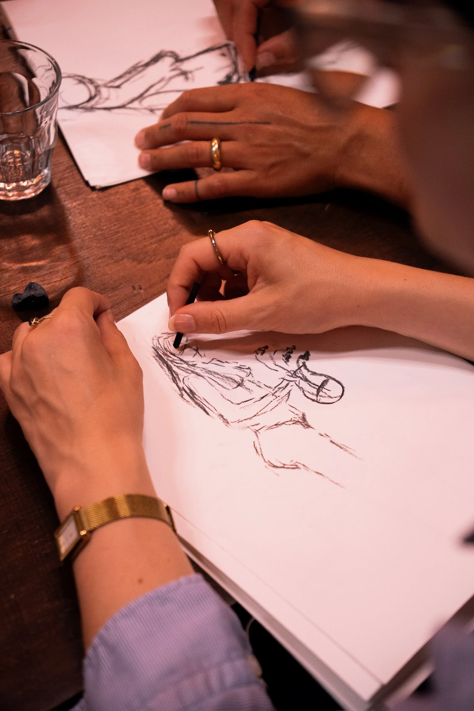 Close-up of someone sketching during a creative drawing workshop at The Art Café in Amsterdam.