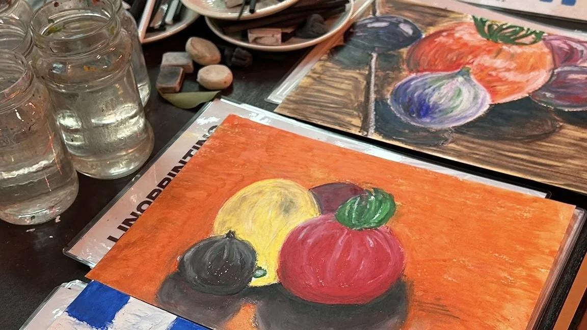 Creative pastel artworks made during a unique group activity at The Art Café in Amsterdam city centre.