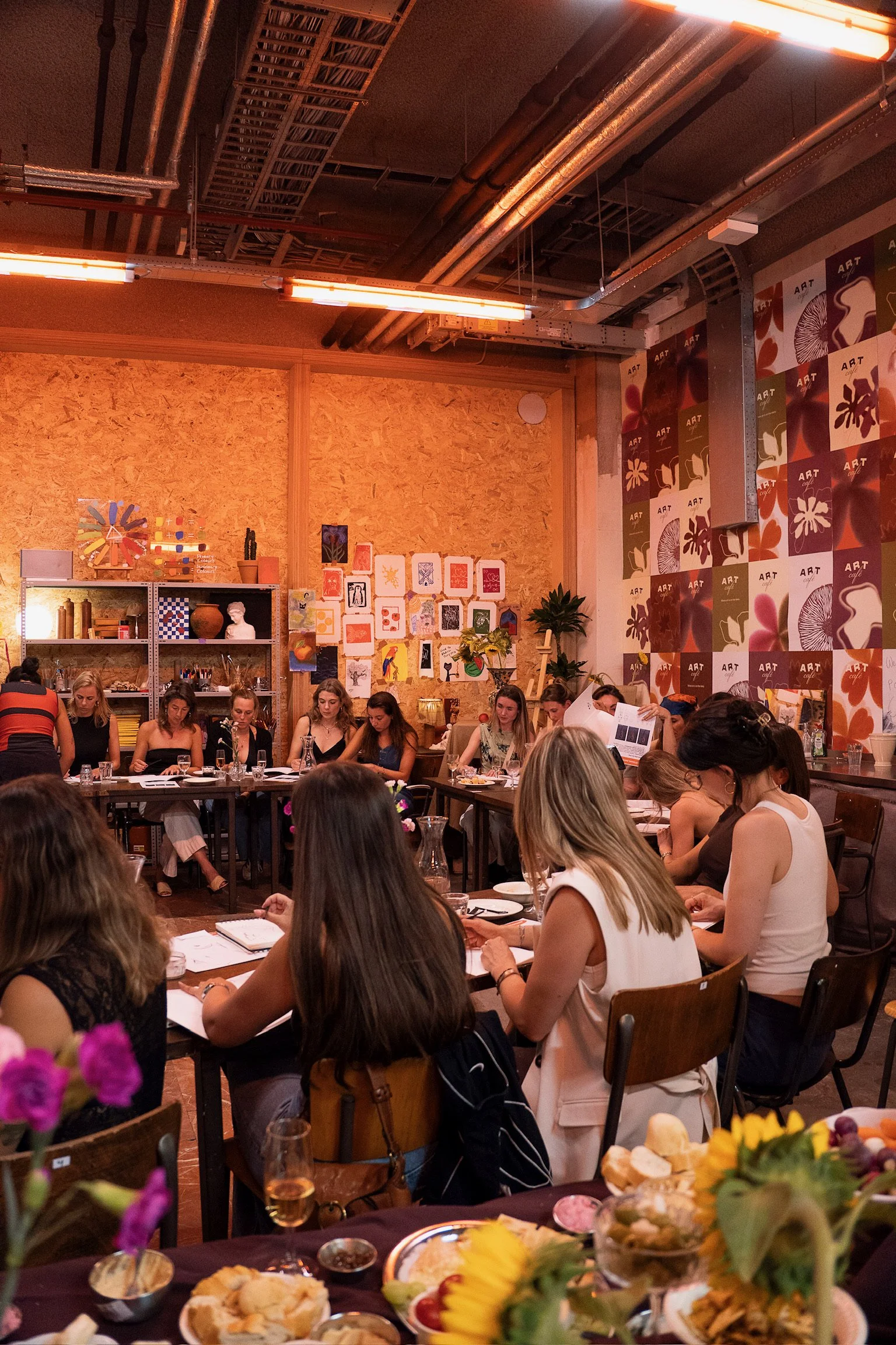 Group of friends enjoying a creative bachelorette party at The Art Café in Amsterdam city centre.