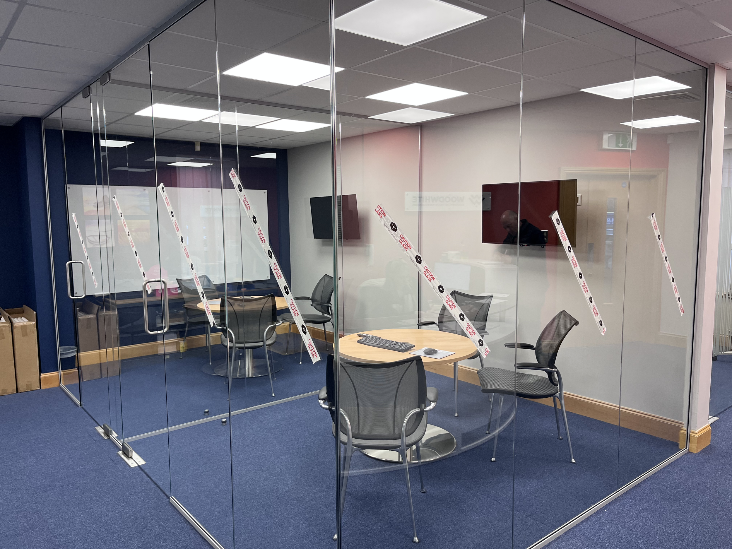 Sleek glass partitioning designed to create bright, modern office spaces