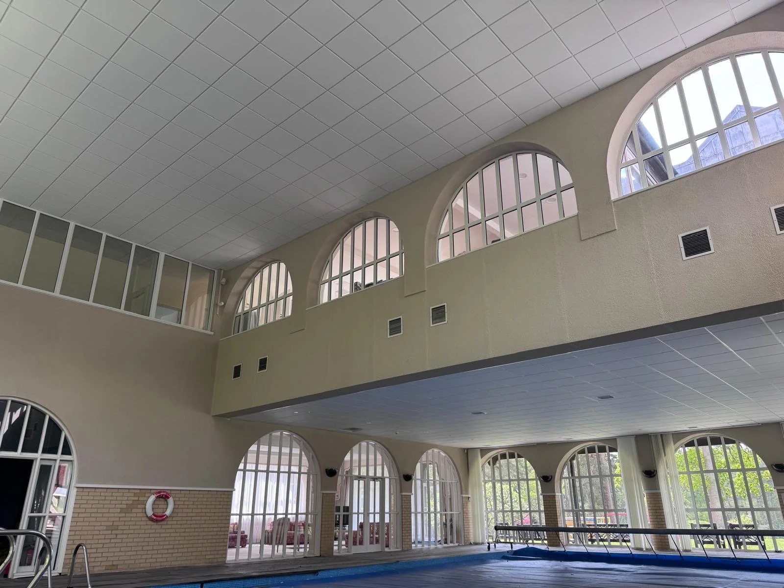 Pool house transformed with new suspended ceilings, giving the space a fresh, modern feel