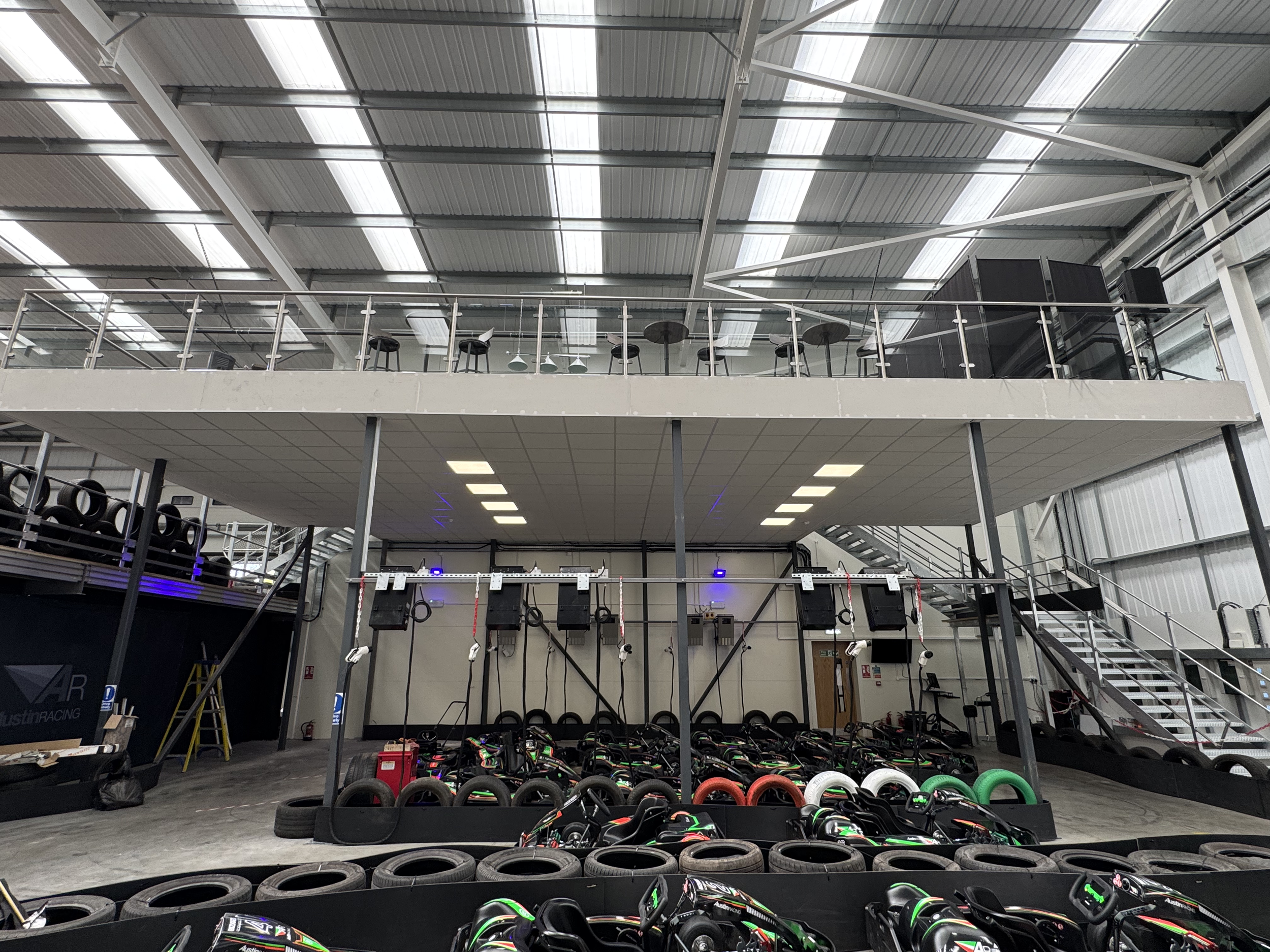 Lay-in suspended ceilings installed within a new go-karting facility to ensure the mezzanine meets fire regulations