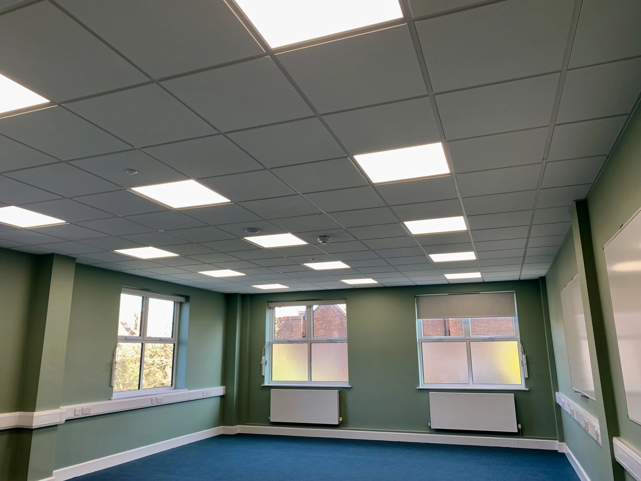 New 600x600 lay-in suspended ceiling installed to brighten and refresh the space
