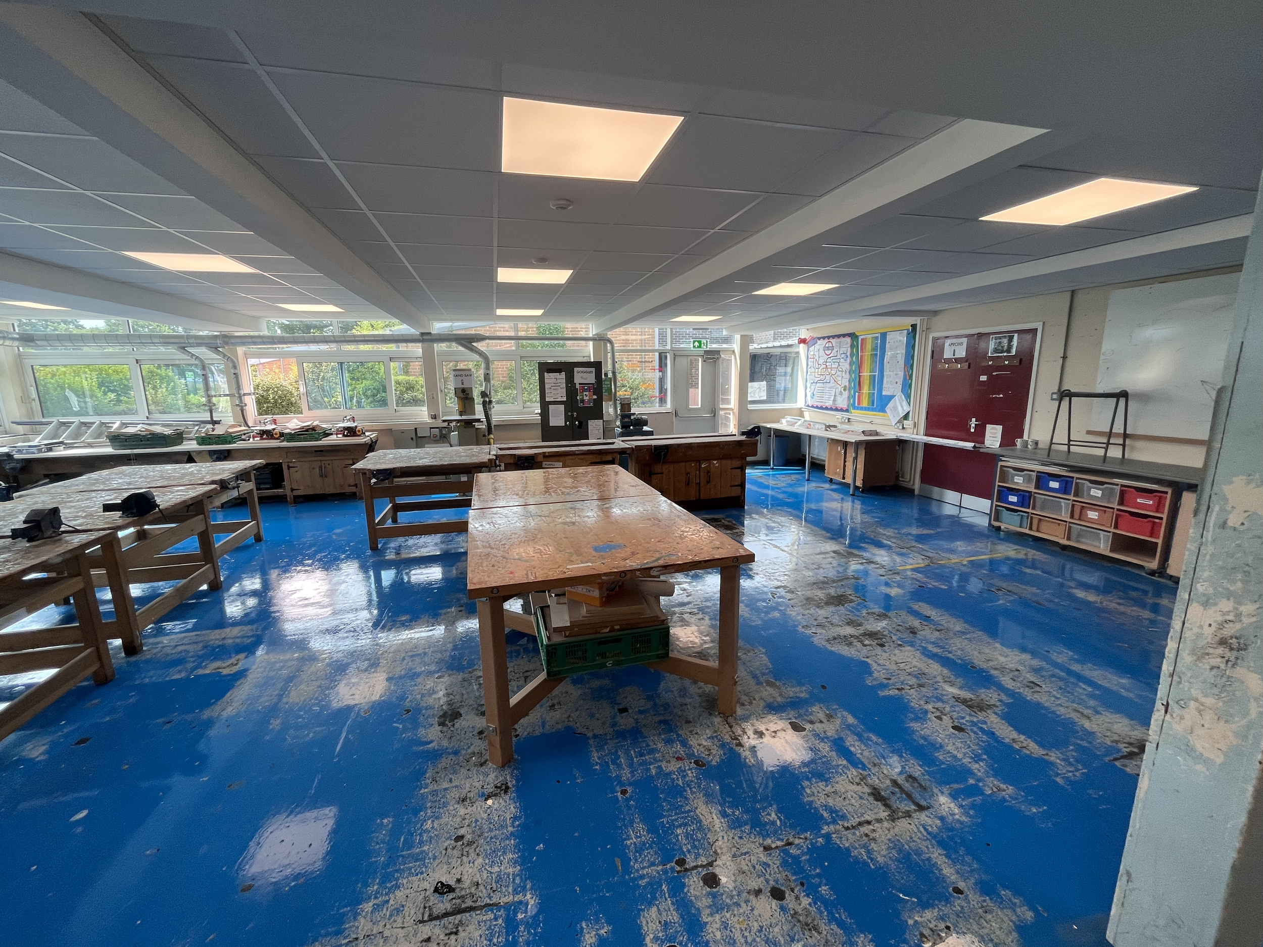 Structural steelwork neatly boxed in, with lay-in suspended ceilings designed to retain maximum ceiling height