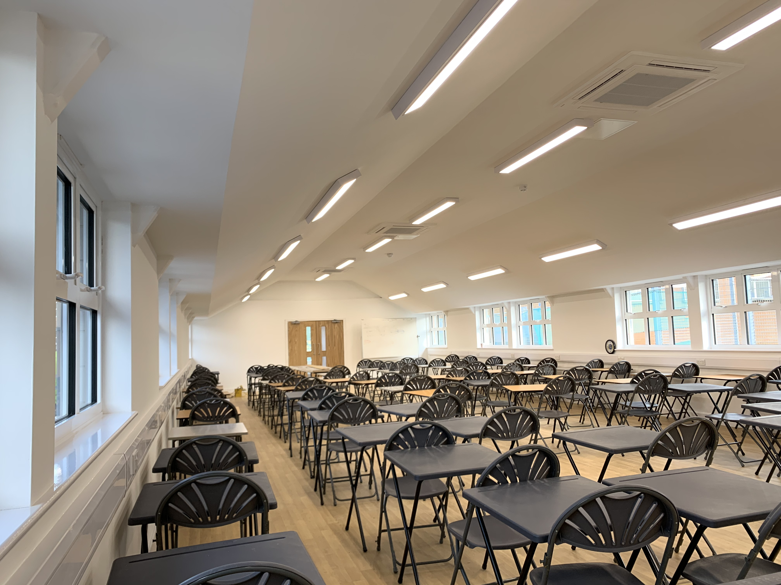 Full refurbishment of a school building, with a bespoke multi-angled MF ceiling installed to modernise the space and hide the existing roof structure
