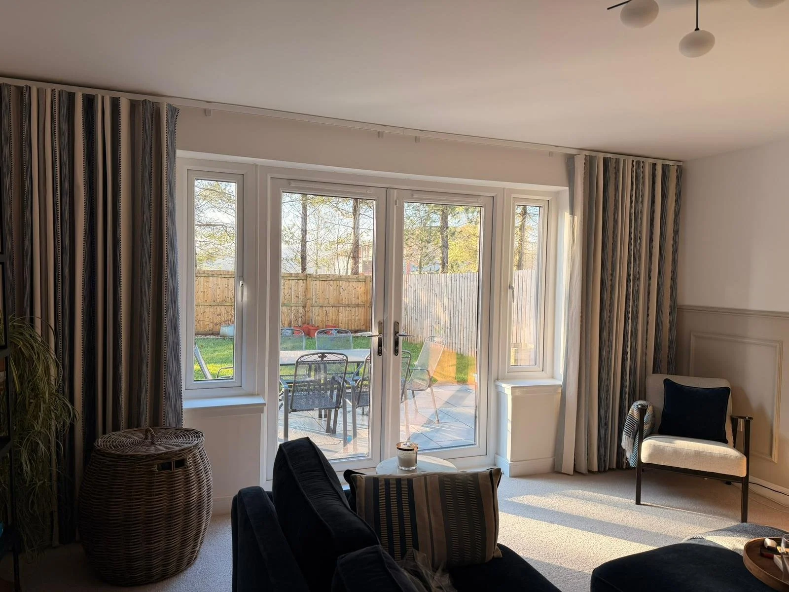 Full room view of this finished space and it really shows how much difference the right curtains make.
Full length wave headed curtains sitting on a discreet square wave track, keeping the lines soft while letting the room and light do the talking.

