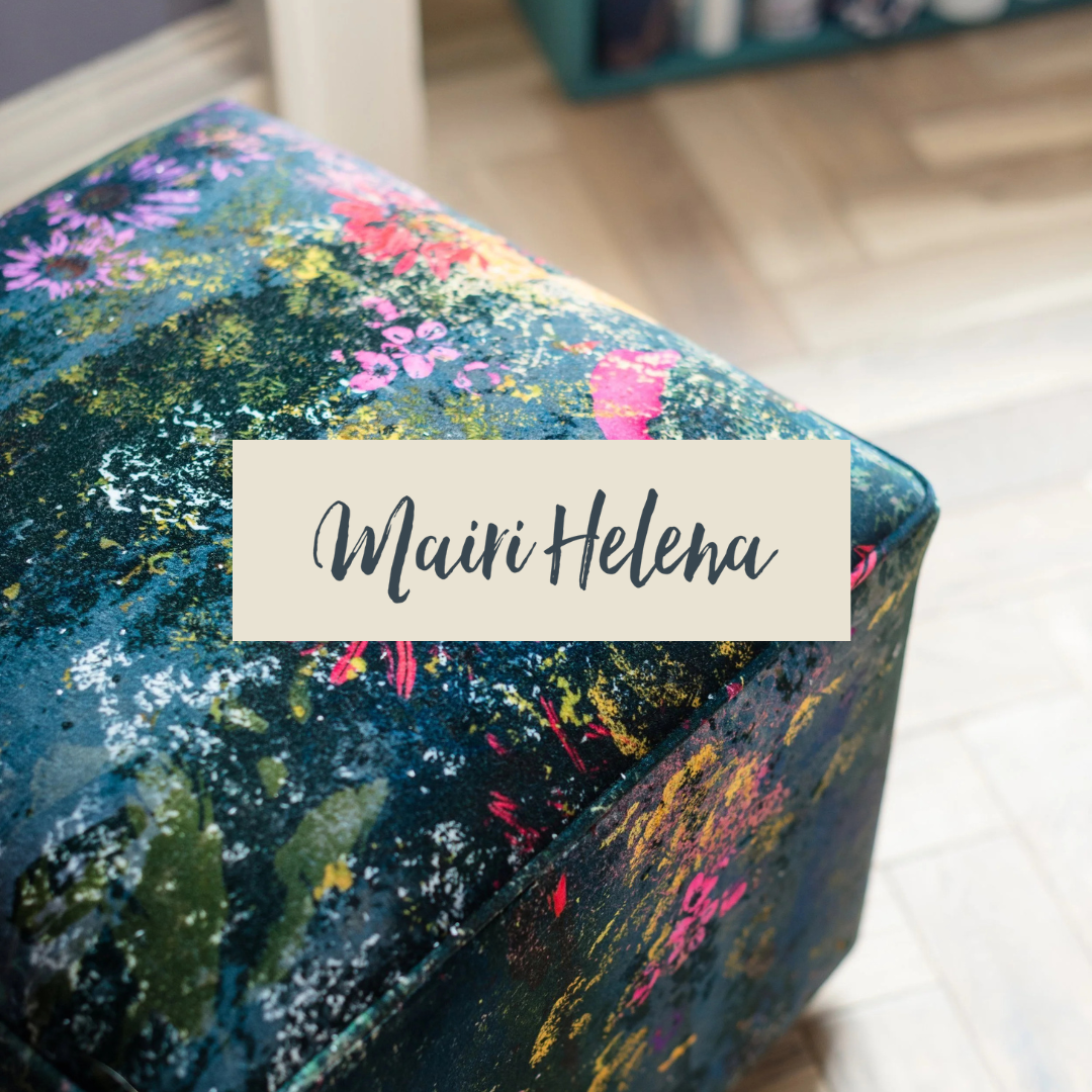 Close-up of a floral-patterned fabric with a name tag reading 'Mairi Helena'.