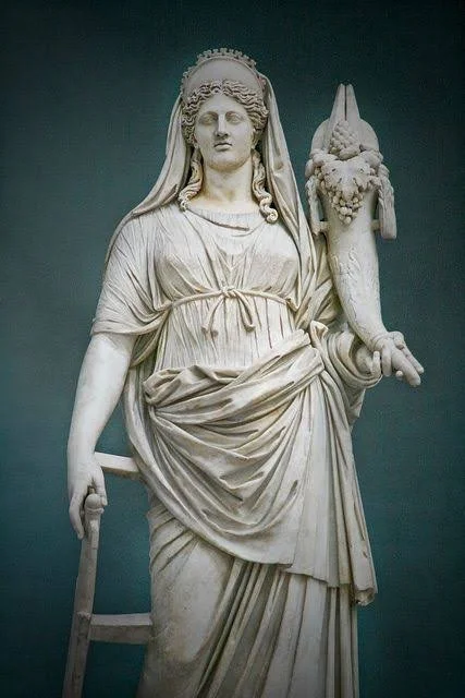 Marble statue of Ceres/Demeter holding a cornucopia of grain and fruit