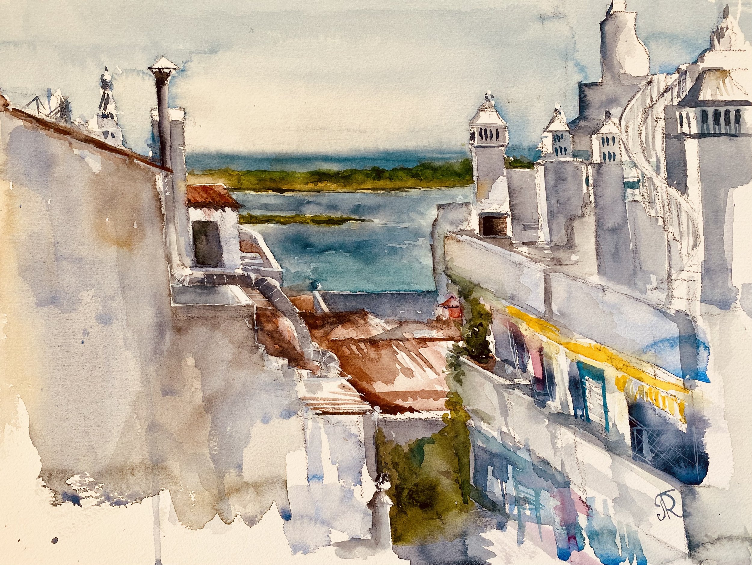 A watercolor painting of a seaside town with white buildings and castle-like structures on the right, a river or bay in the distance, and a partly cloudy sky.