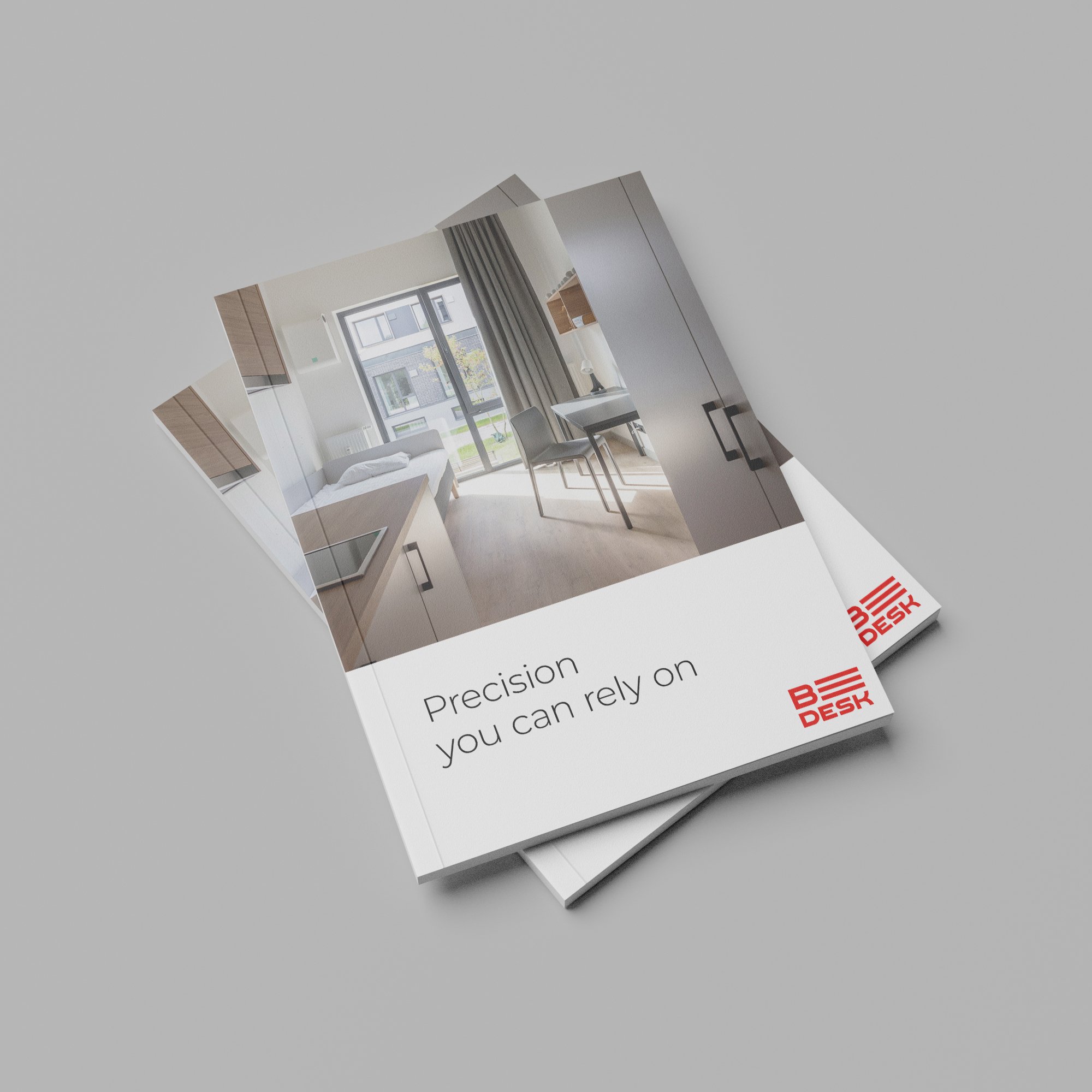 Two brochures for B DESK showing a modern room with a bed, desk, and window