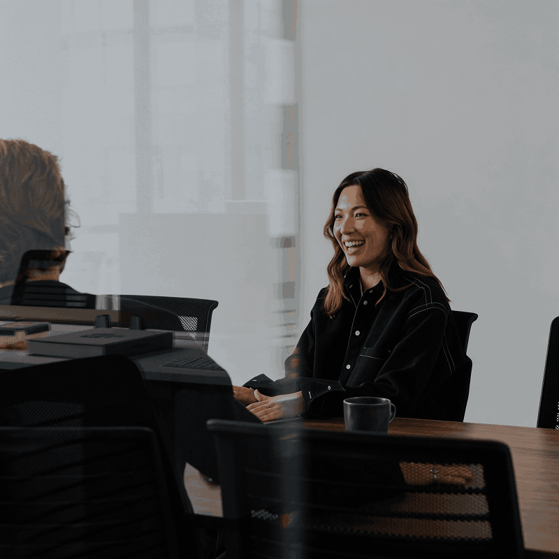 Candidate smiling confidently during a job interview in a professional setting