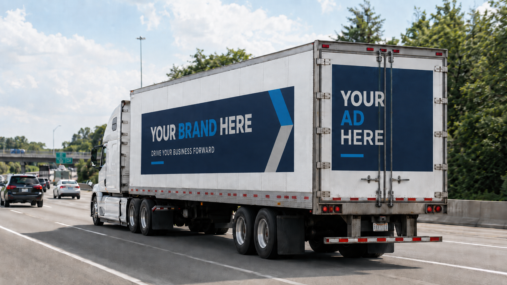 A large white moving truck on a highway with customizable advertising space on its side and back, currently displaying a promotional message.