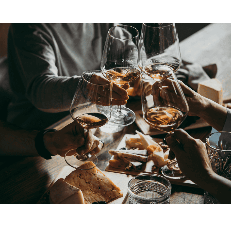 friends toasting their glasses of wine together