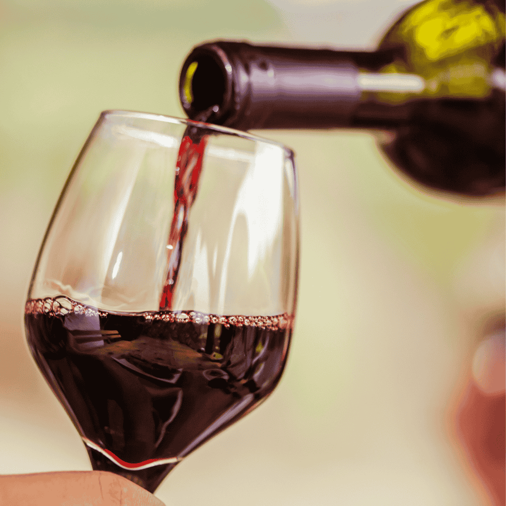 pouring a bottle of red wine