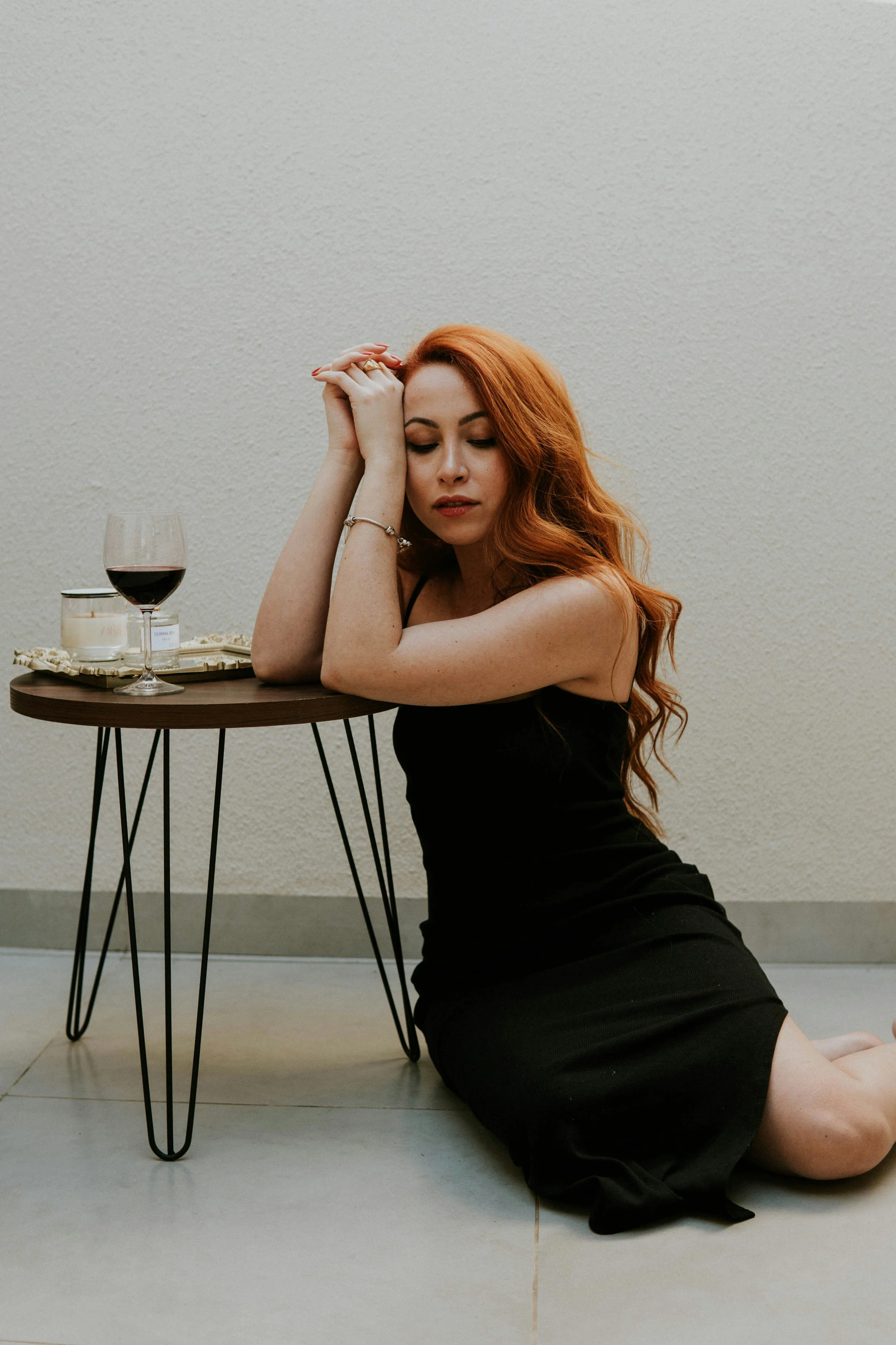 Woman with a wine headache, thinking how to get rid of a wine headache