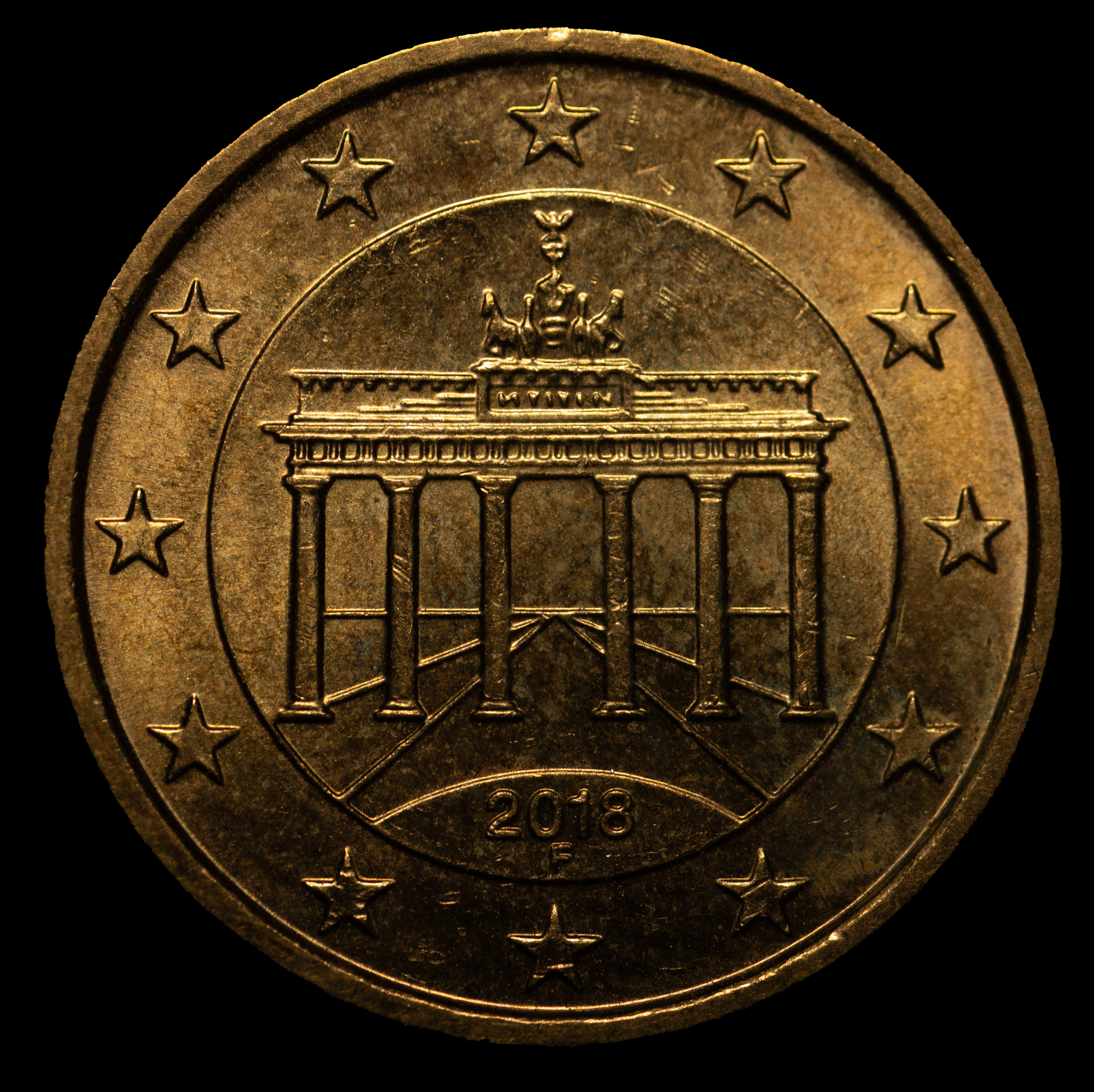 A 2018 Euro cent coin displaying the Brandenburg Gate in Germany with the year 2018 below and a circle of twelve stars around the edge.