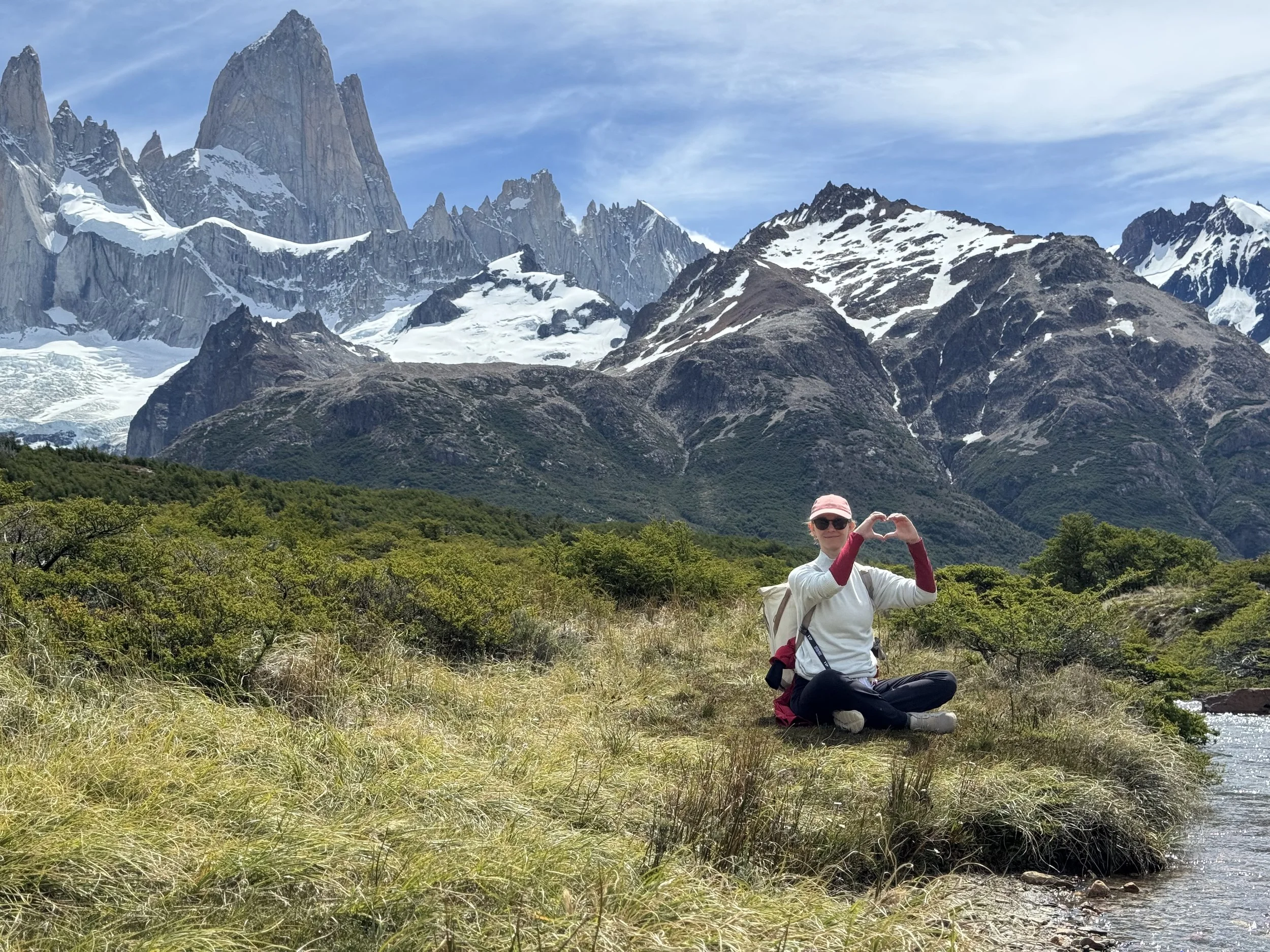Elisabeth during one of her travels, with mountains in the background